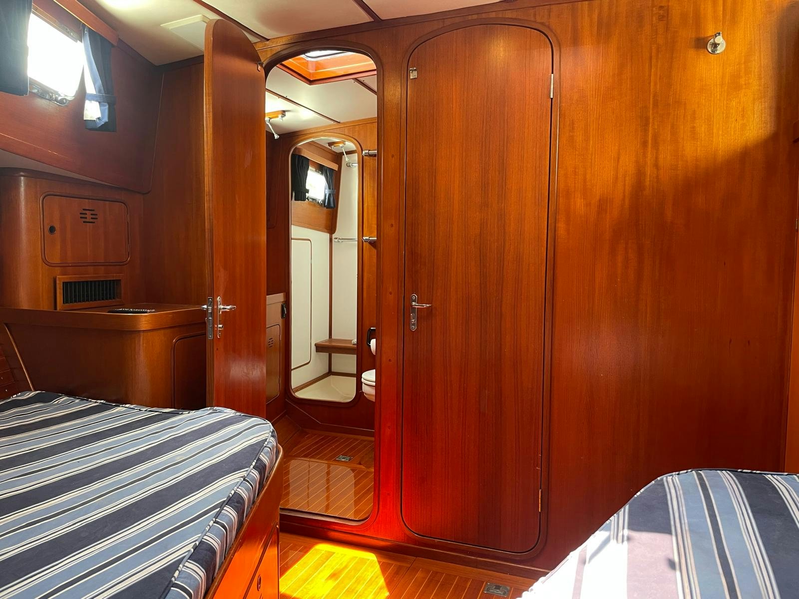 a wooden cabin with a wood door aboard SOUTHERLY Yacht for Sale