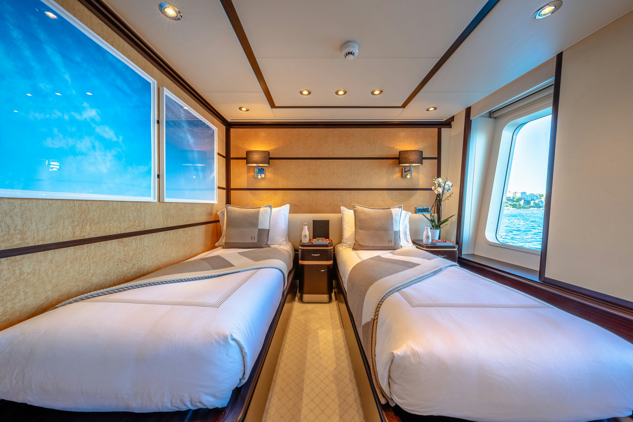 a room with two beds aboard GLADIATOR Yacht for Charter