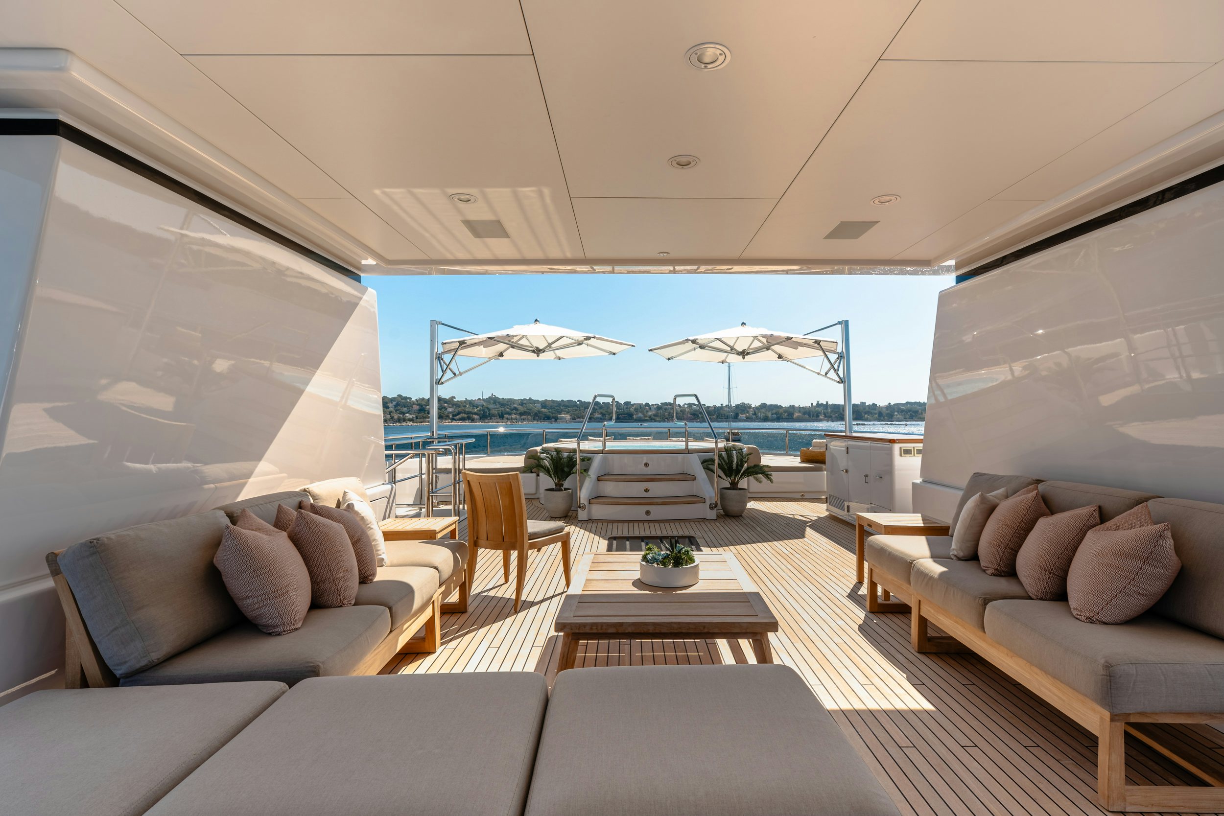 a living room with a large patio aboard GLADIATOR Yacht for Charter