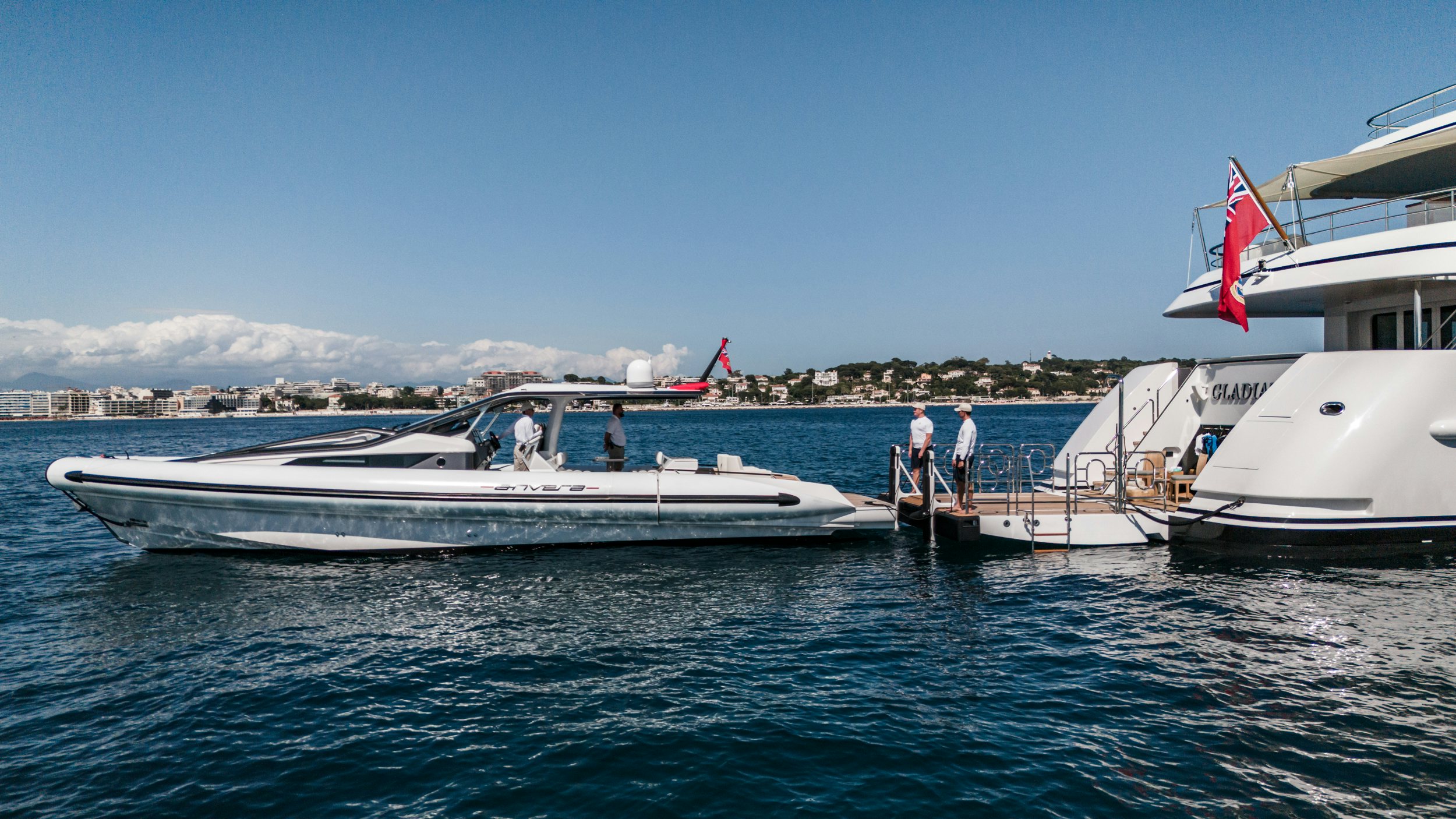 a couple of boats are in the water aboard GLADIATOR Yacht for Charter