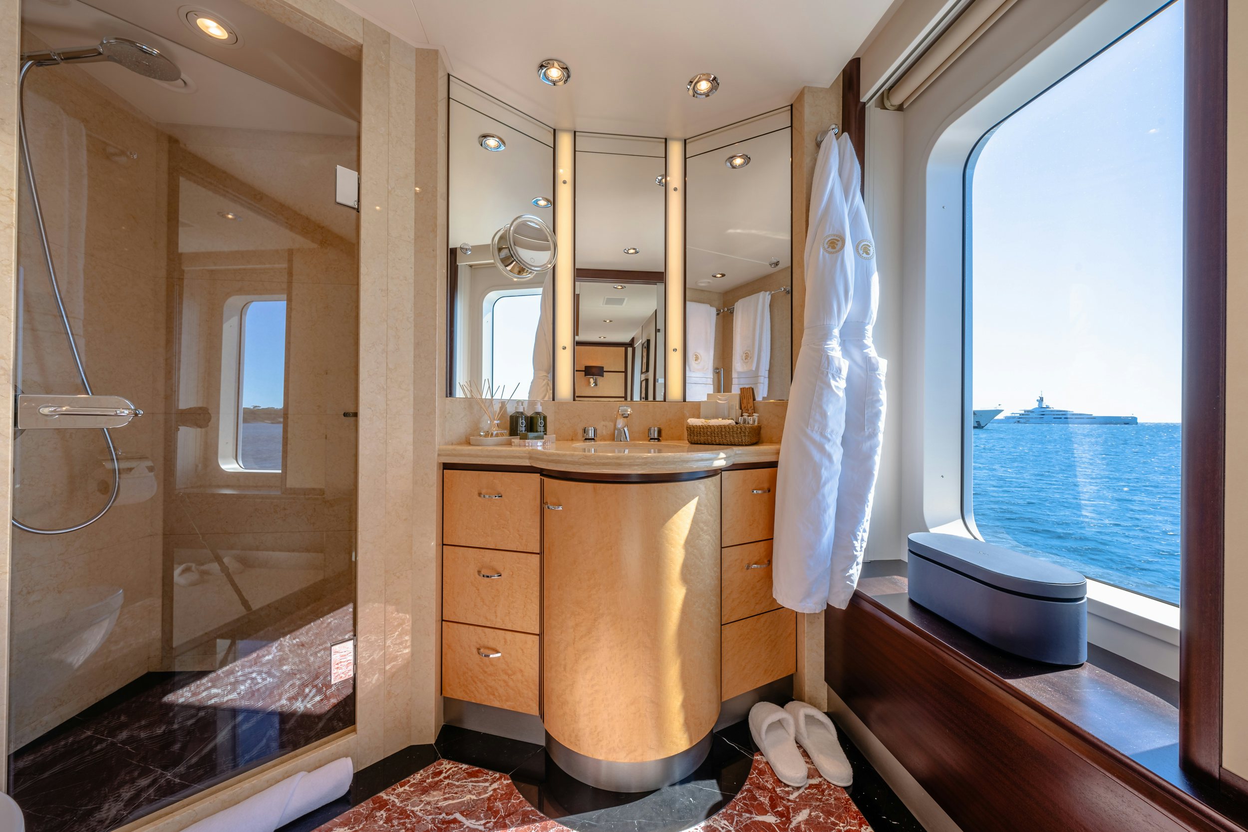 a bathroom with a large window aboard GLADIATOR Yacht for Charter