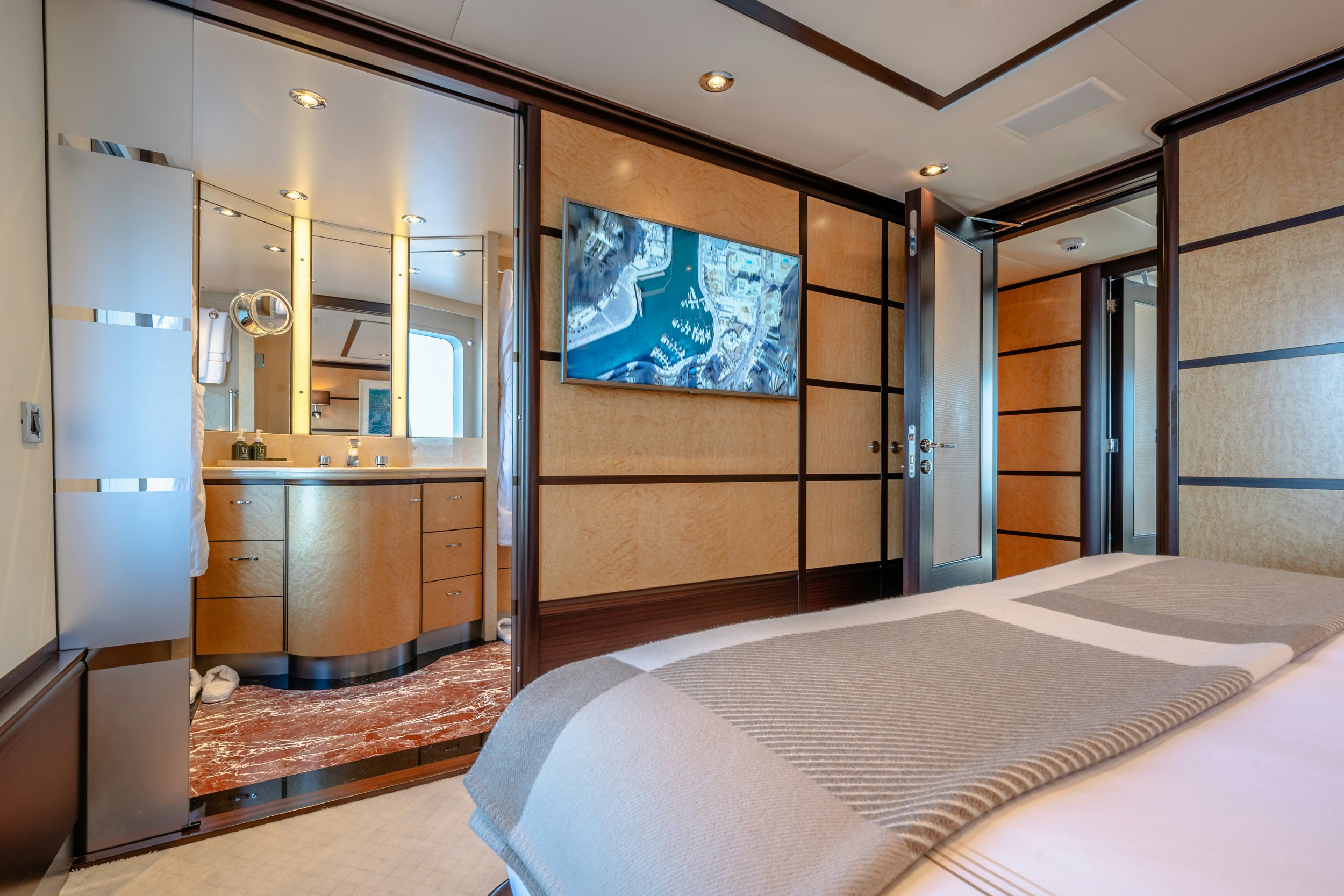 a large bathroom with a large mirror aboard GLADIATOR Yacht for Charter