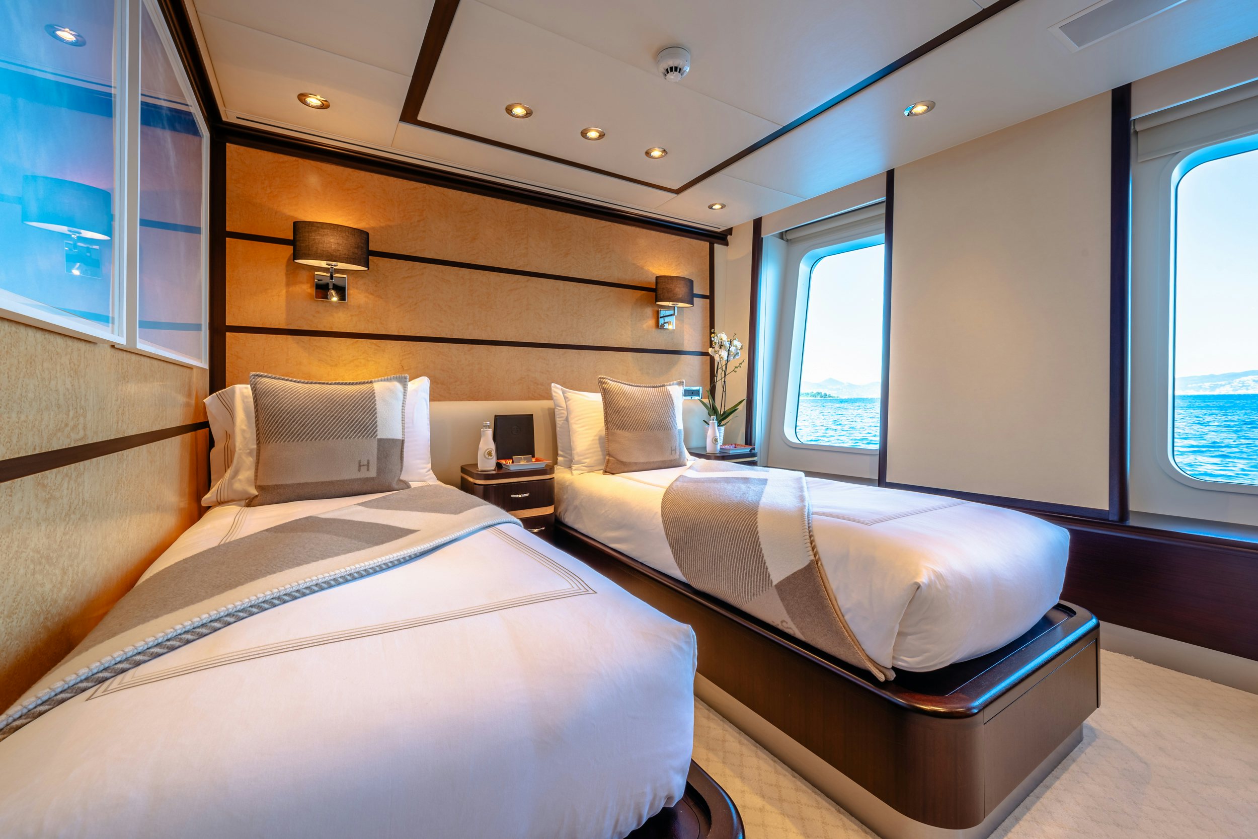 a room with two beds aboard GLADIATOR Yacht for Charter