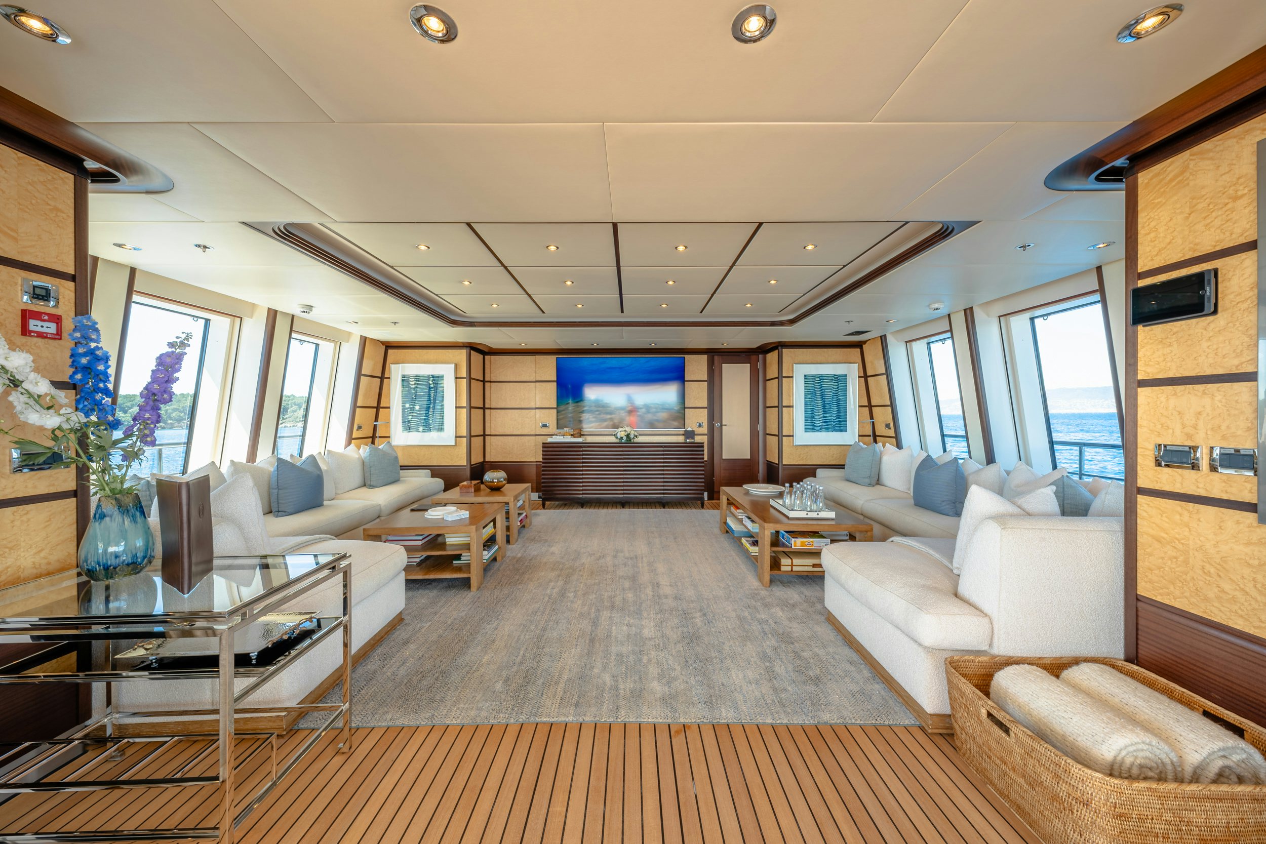 a living room with a large window aboard GLADIATOR Yacht for Charter