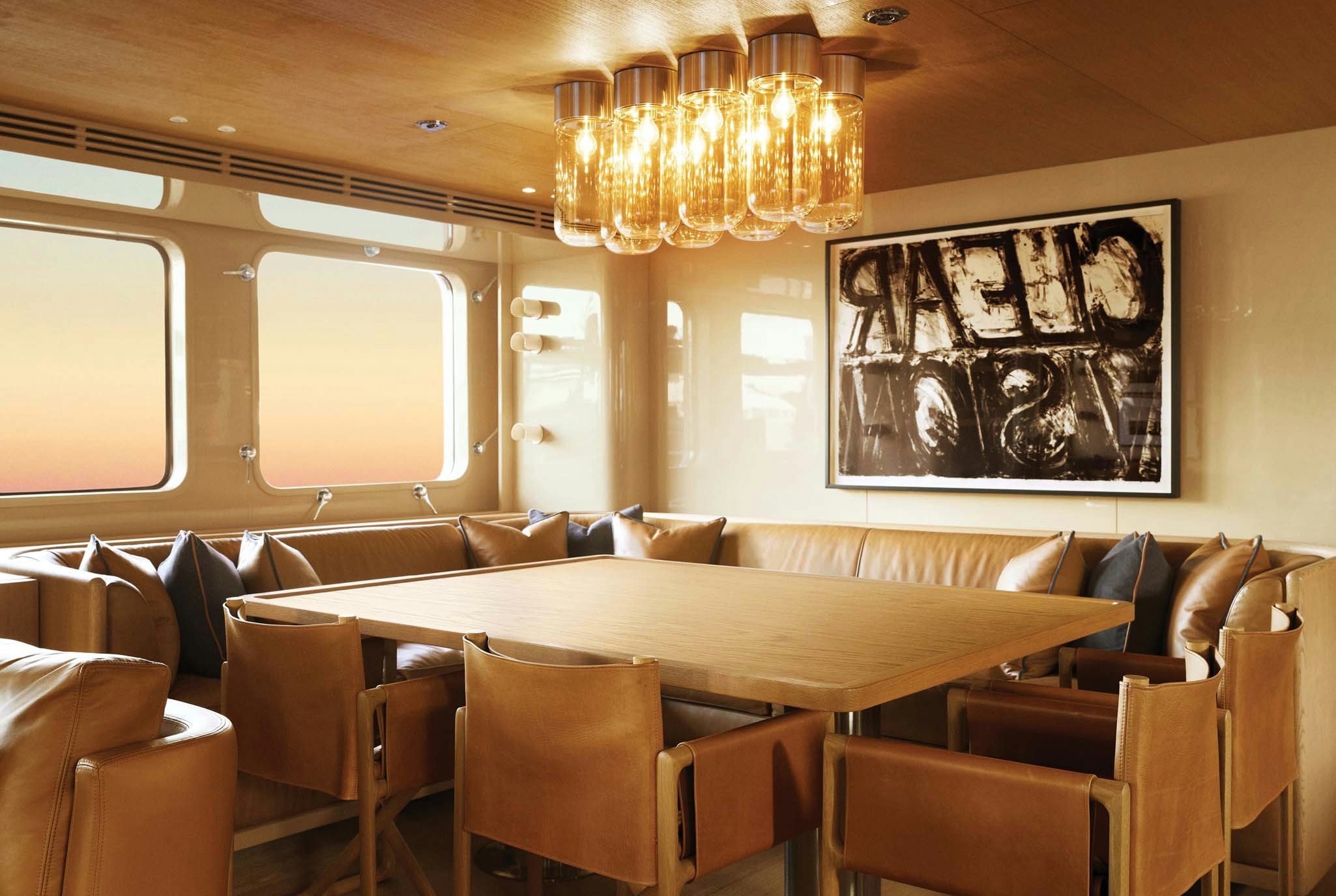 a room with a chandelier and chairs aboard RH THREE Yacht for Charter