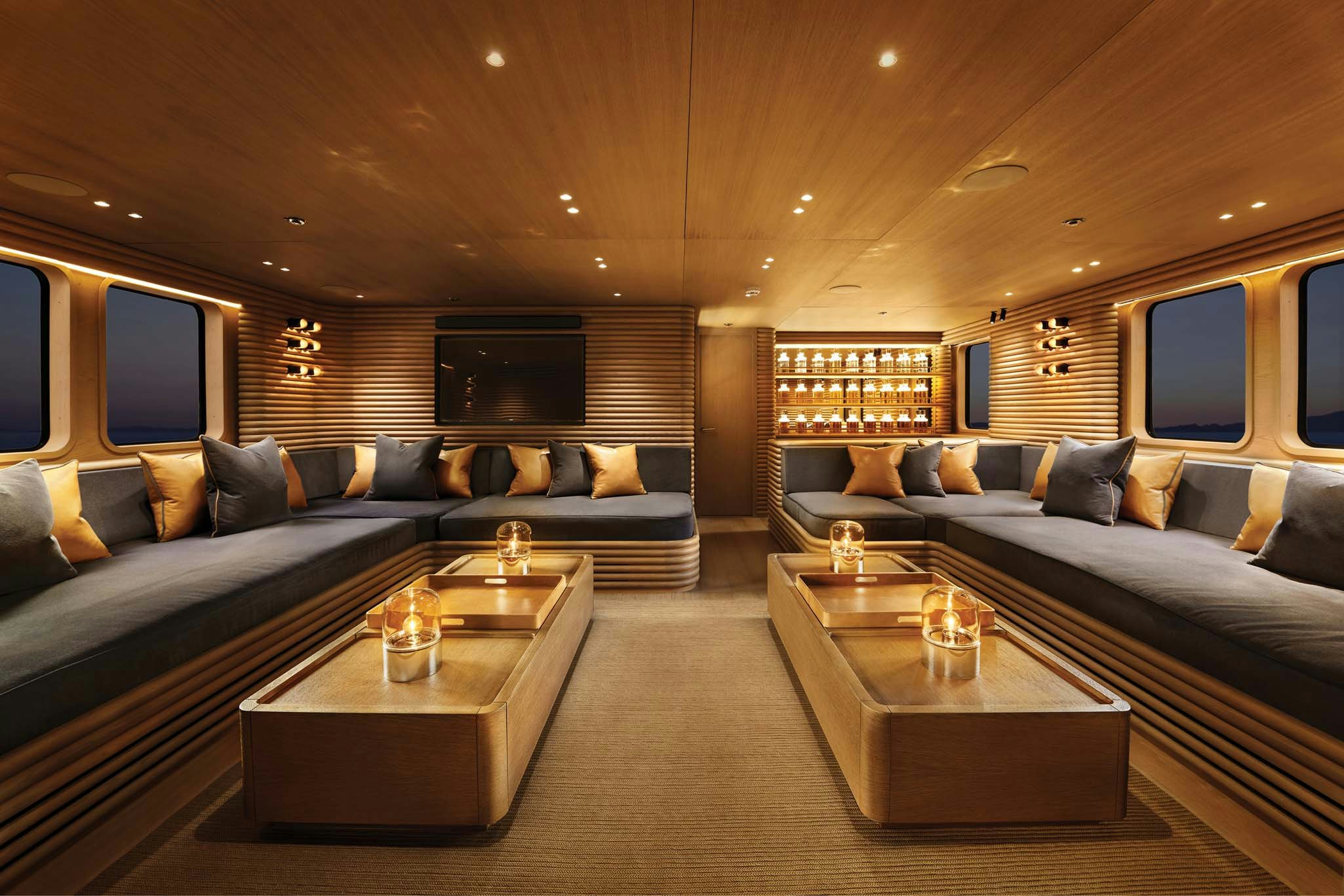 a living room with a couch and a coffee table aboard RH THREE Yacht for Charter