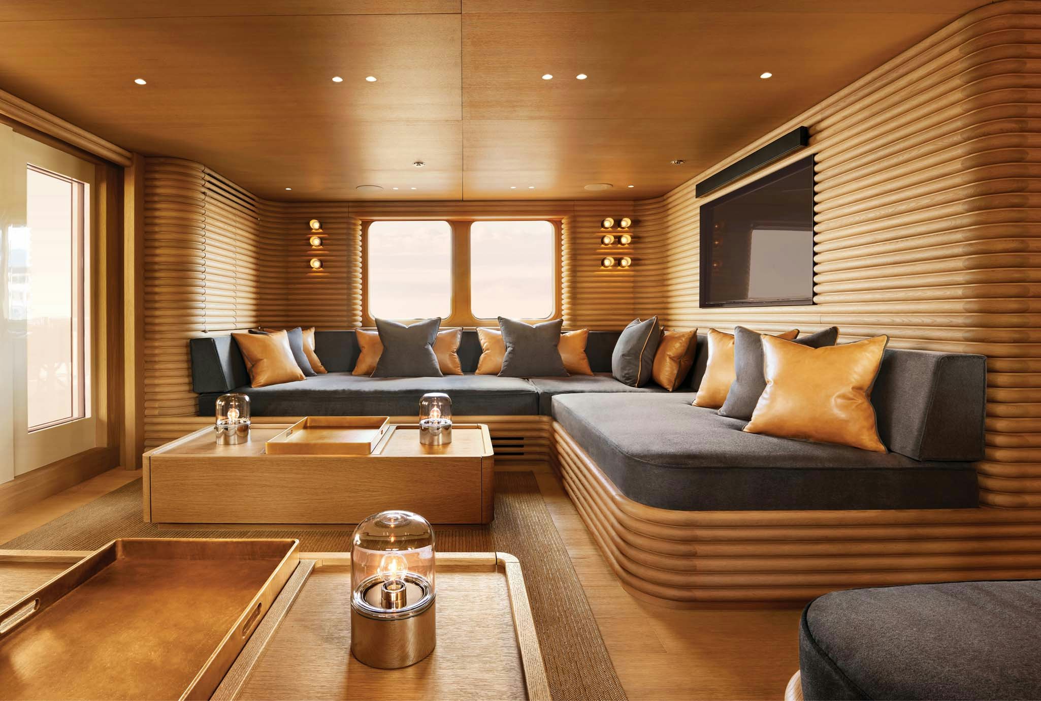 a living room with a couch and a coffee table aboard RH THREE Yacht for Charter