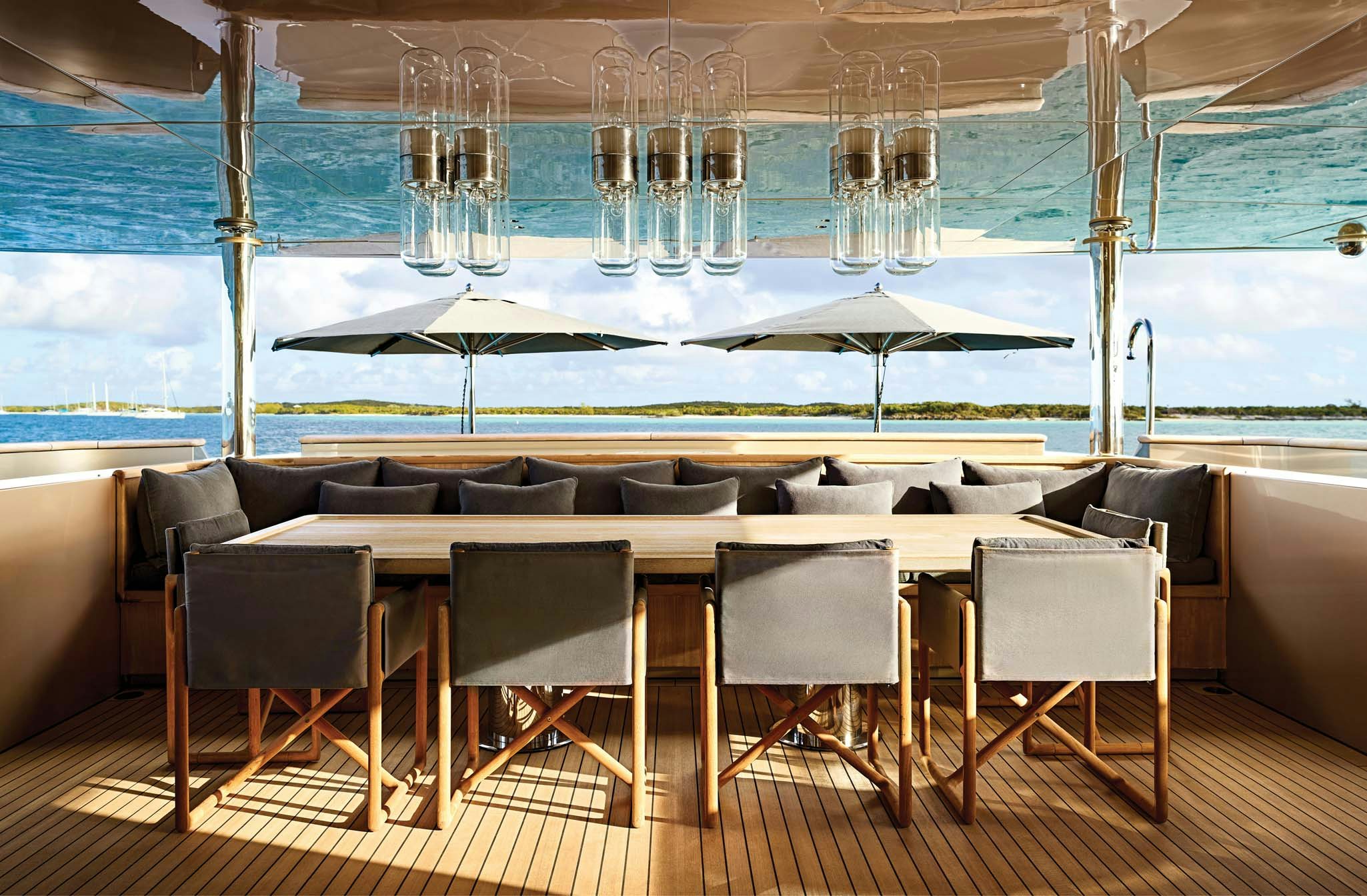 a room with a table and chairs aboard RH THREE Yacht for Charter