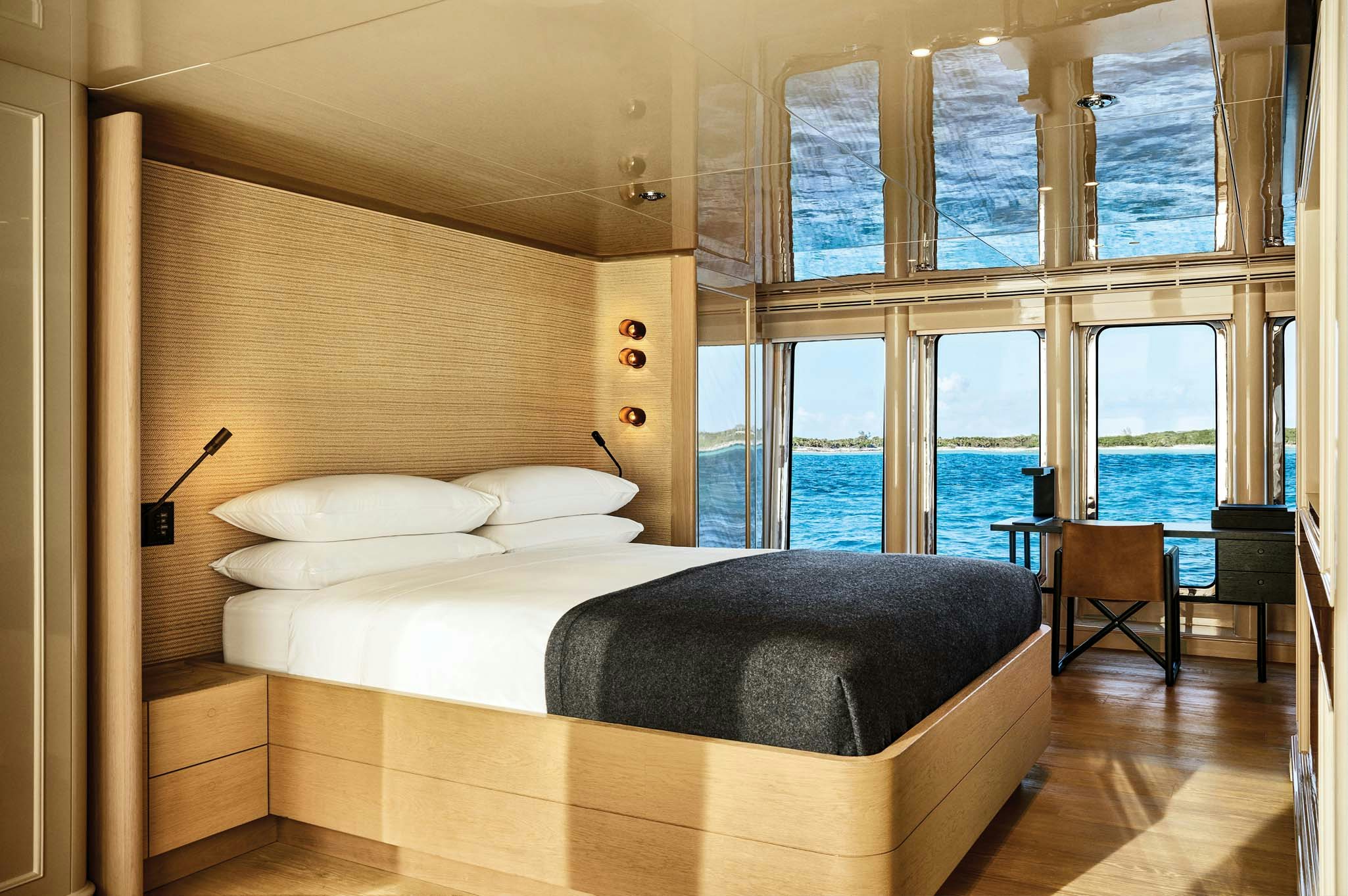a room with a bed and a window aboard RH THREE Yacht for Charter