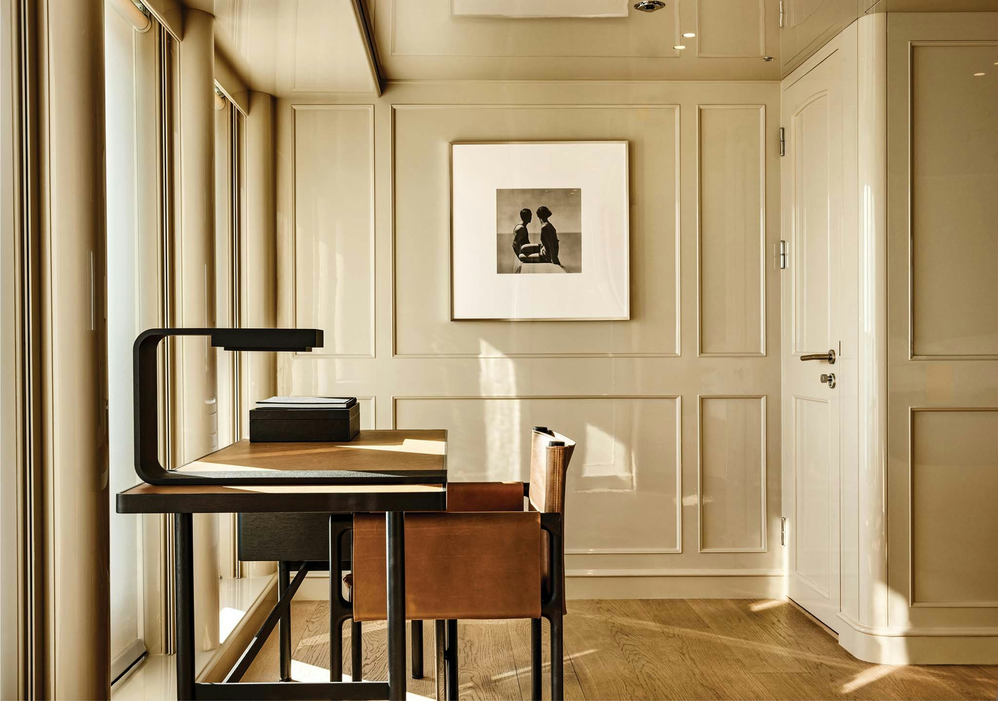 a room with a table and chairs aboard RH THREE Yacht for Charter