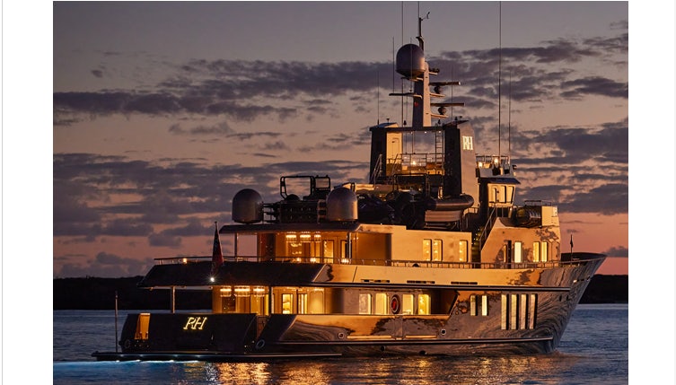 a large ship in the water aboard RH THREE Yacht for Charter