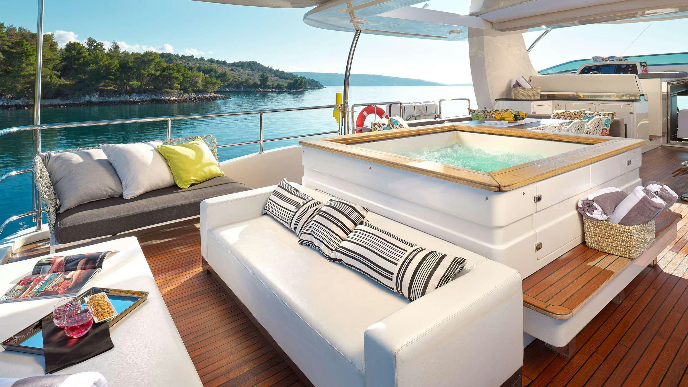 a room with a bed and a couch aboard OCEAN DRIVE Yacht for Charter