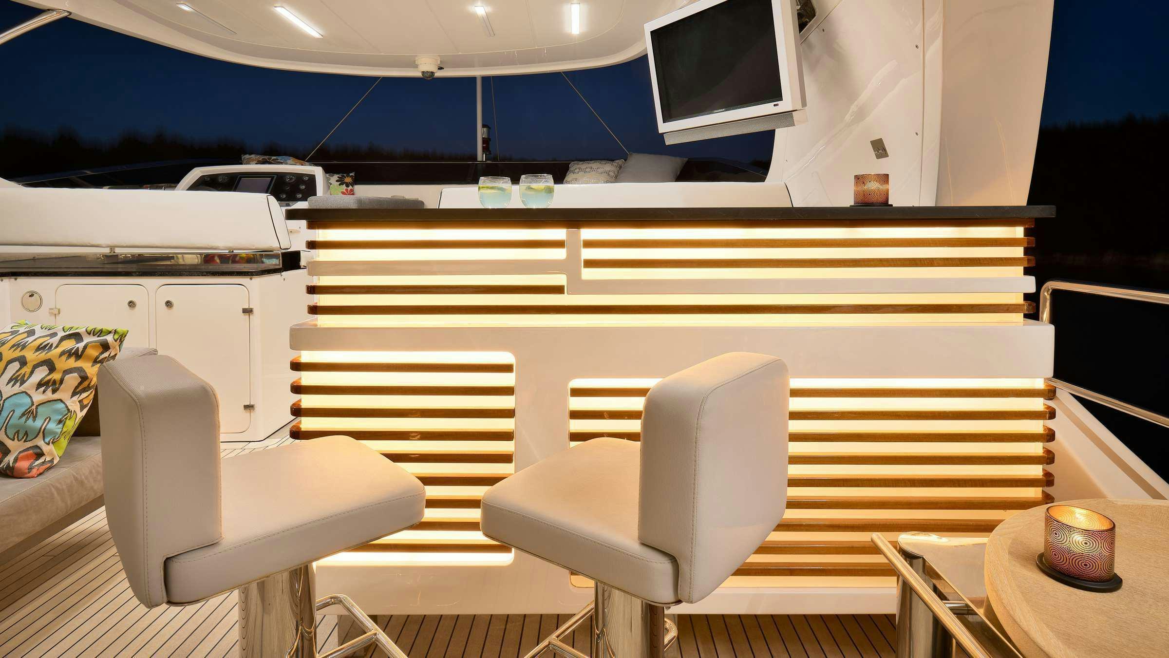 a room with a desk and chairs aboard OCEAN DRIVE Yacht for Charter