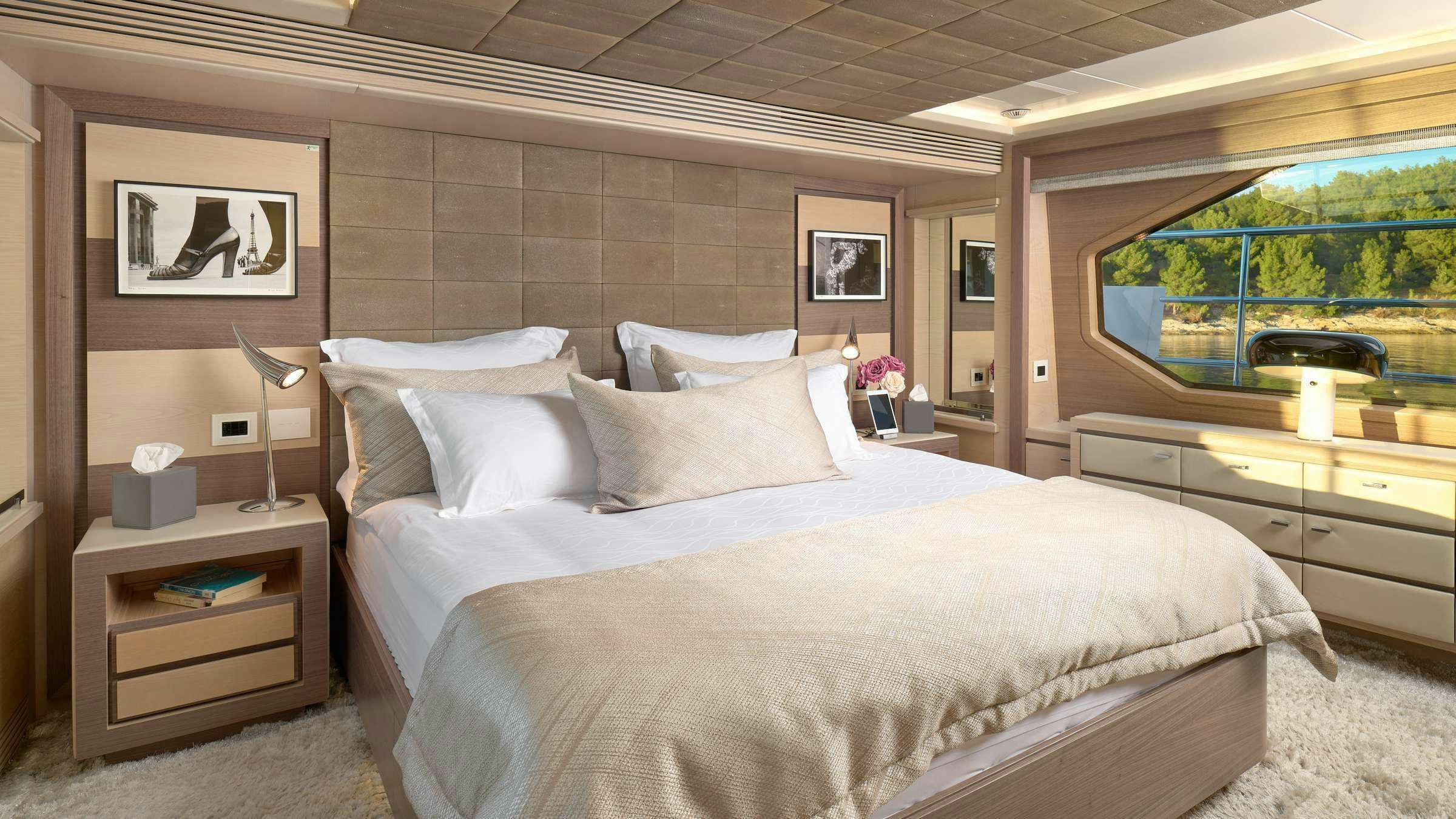 a bed with a white sheet aboard OCEAN DRIVE Yacht for Charter