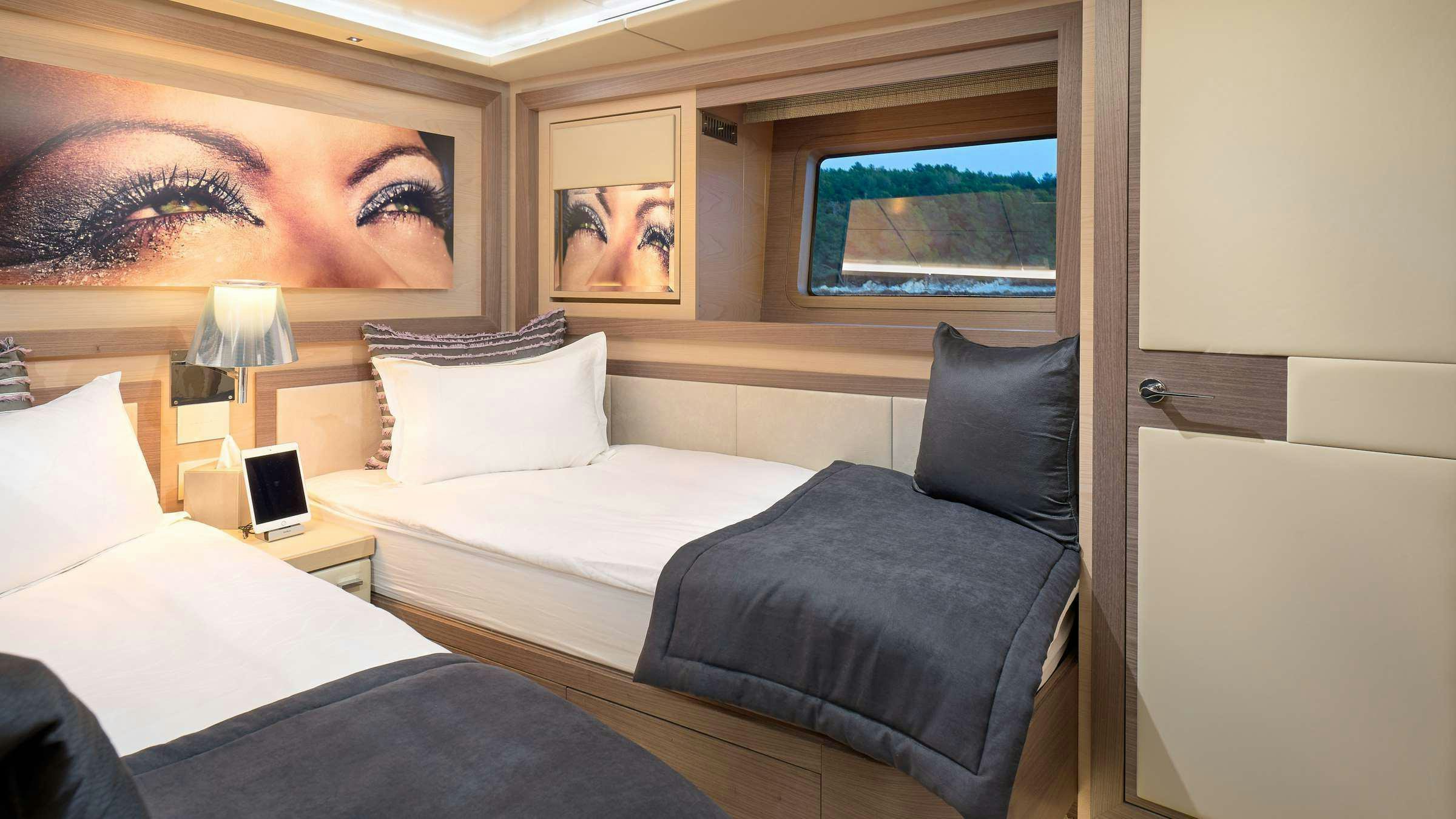 a room with two beds aboard OCEAN DRIVE Yacht for Charter