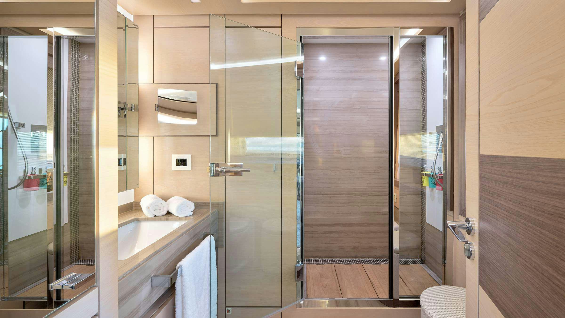 a bathroom with a shower unit aboard OCEAN DRIVE Yacht for Charter