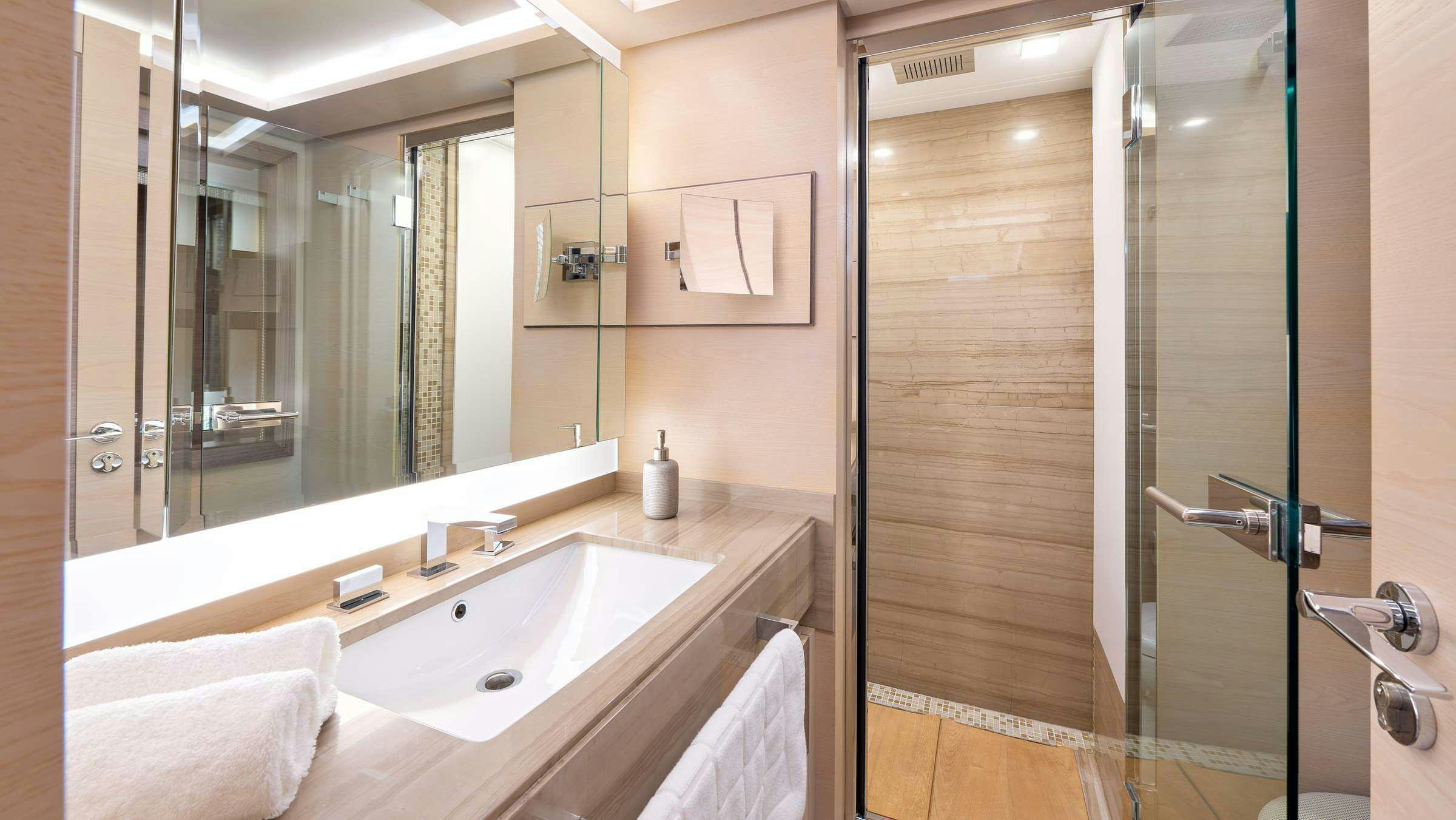 a bathroom with a sink and shower aboard OCEAN DRIVE Yacht for Charter
