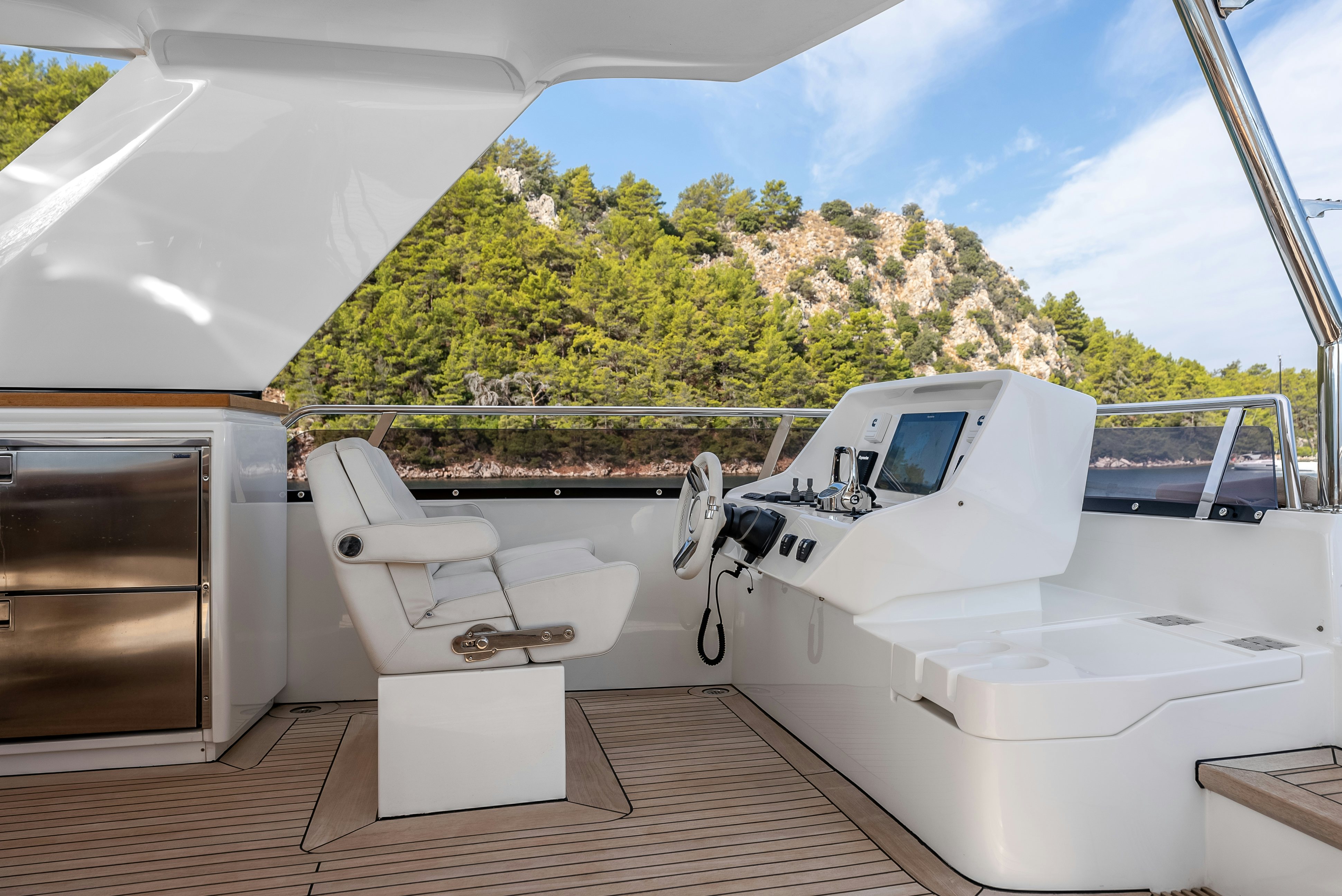 a boat on a deck aboard LITTLE MERMAID Yacht for Sale