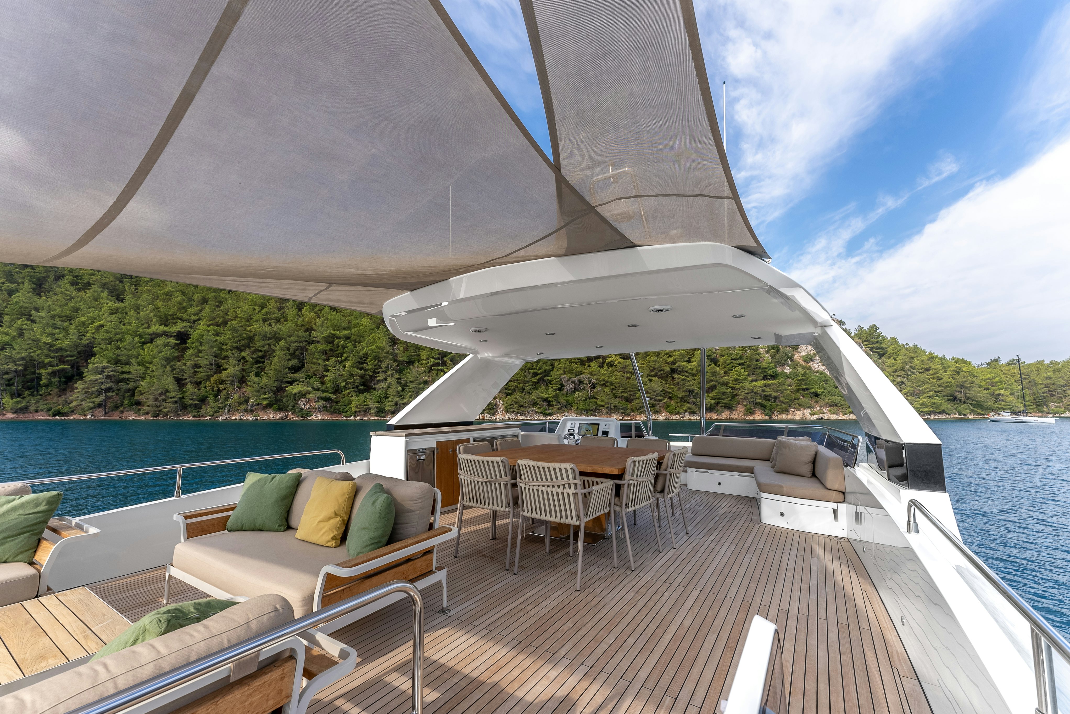 a boat on a deck aboard LITTLE MERMAID Yacht for Sale