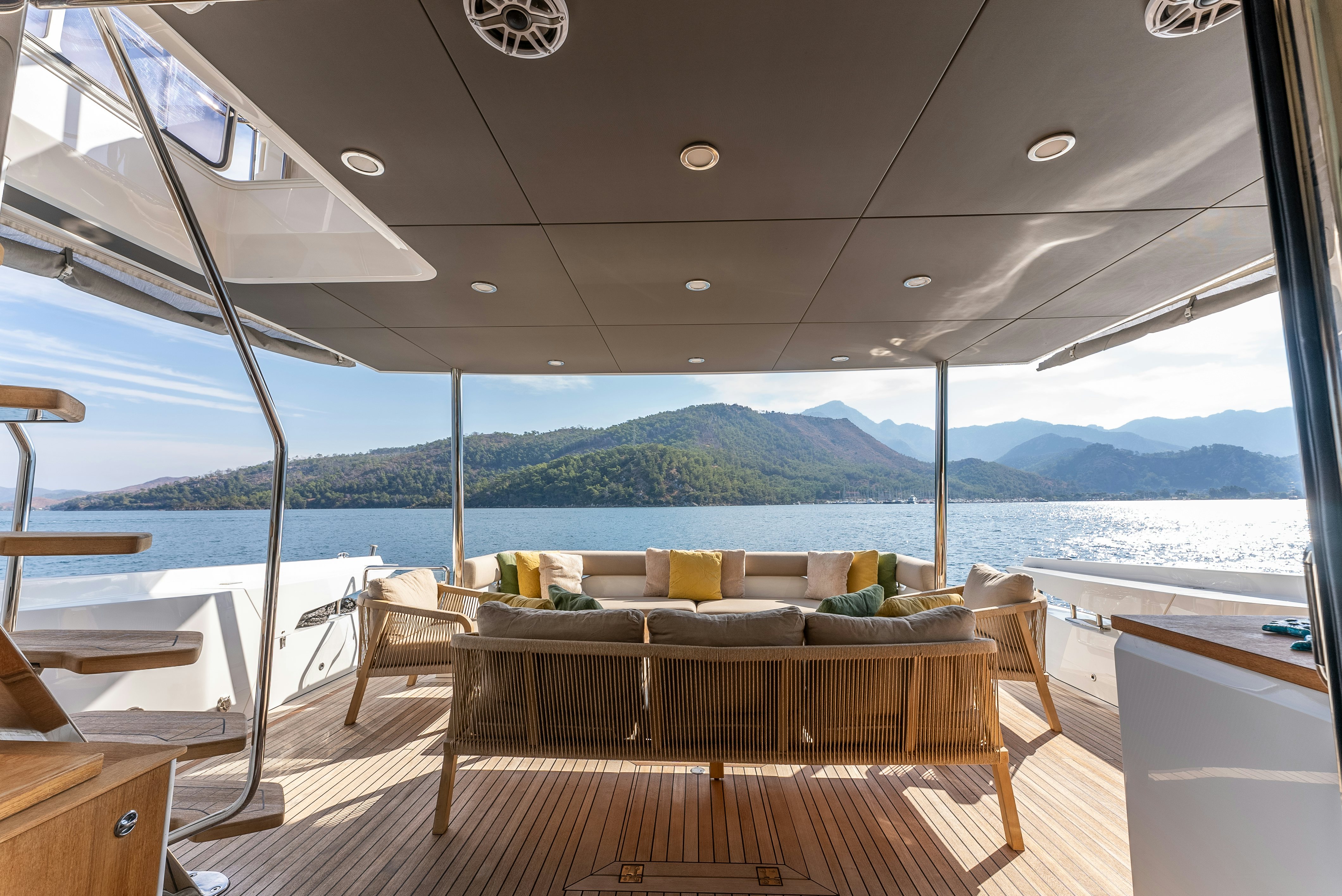 a room with a couch and a table and chairs aboard LITTLE MERMAID Yacht for Sale