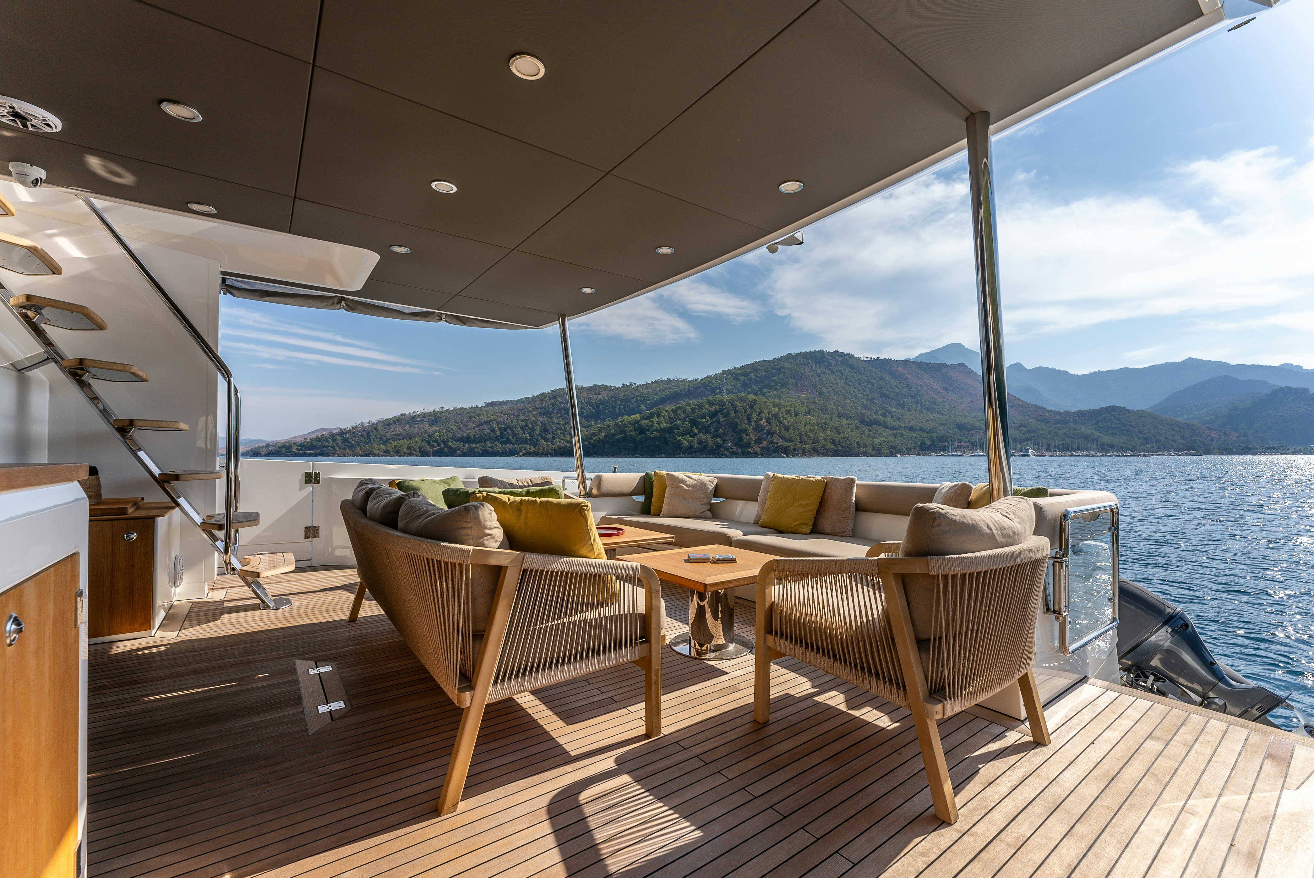 a deck with chairs and a large body of water aboard LITTLE MERMAID Yacht for Sale