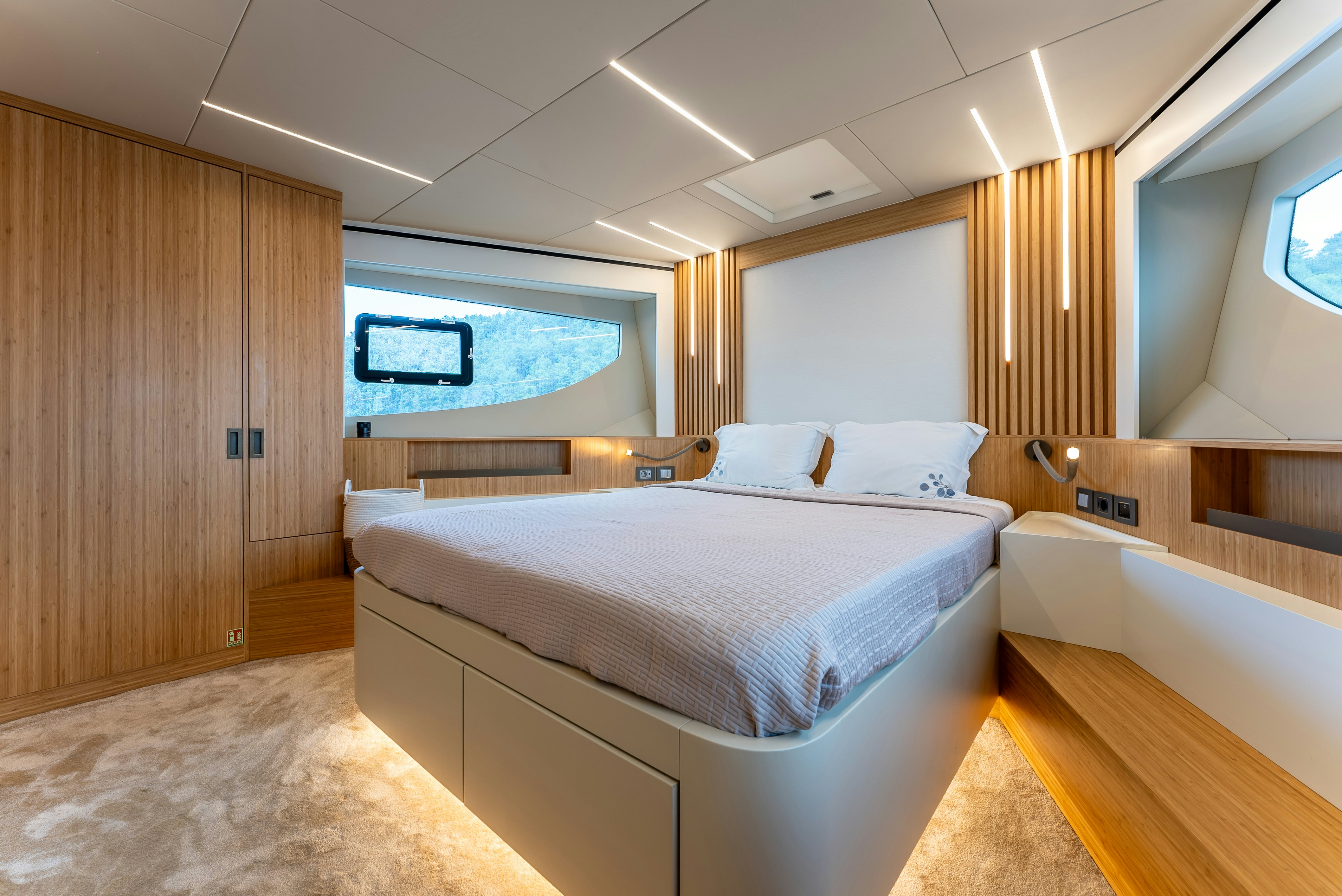 a room with a bed and a television aboard LITTLE MERMAID Yacht for Sale