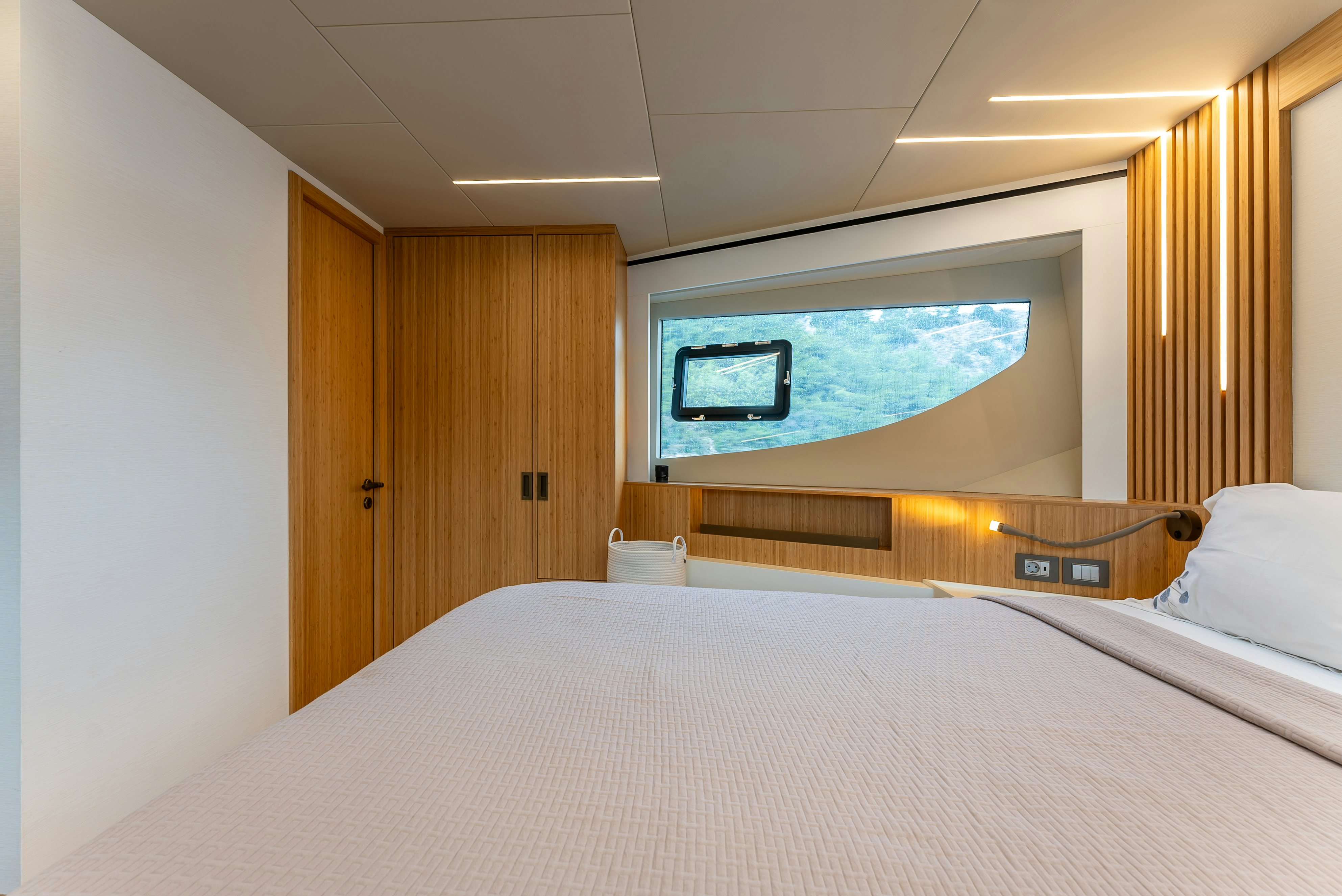 a room with a bed and a television aboard LITTLE MERMAID Yacht for Sale