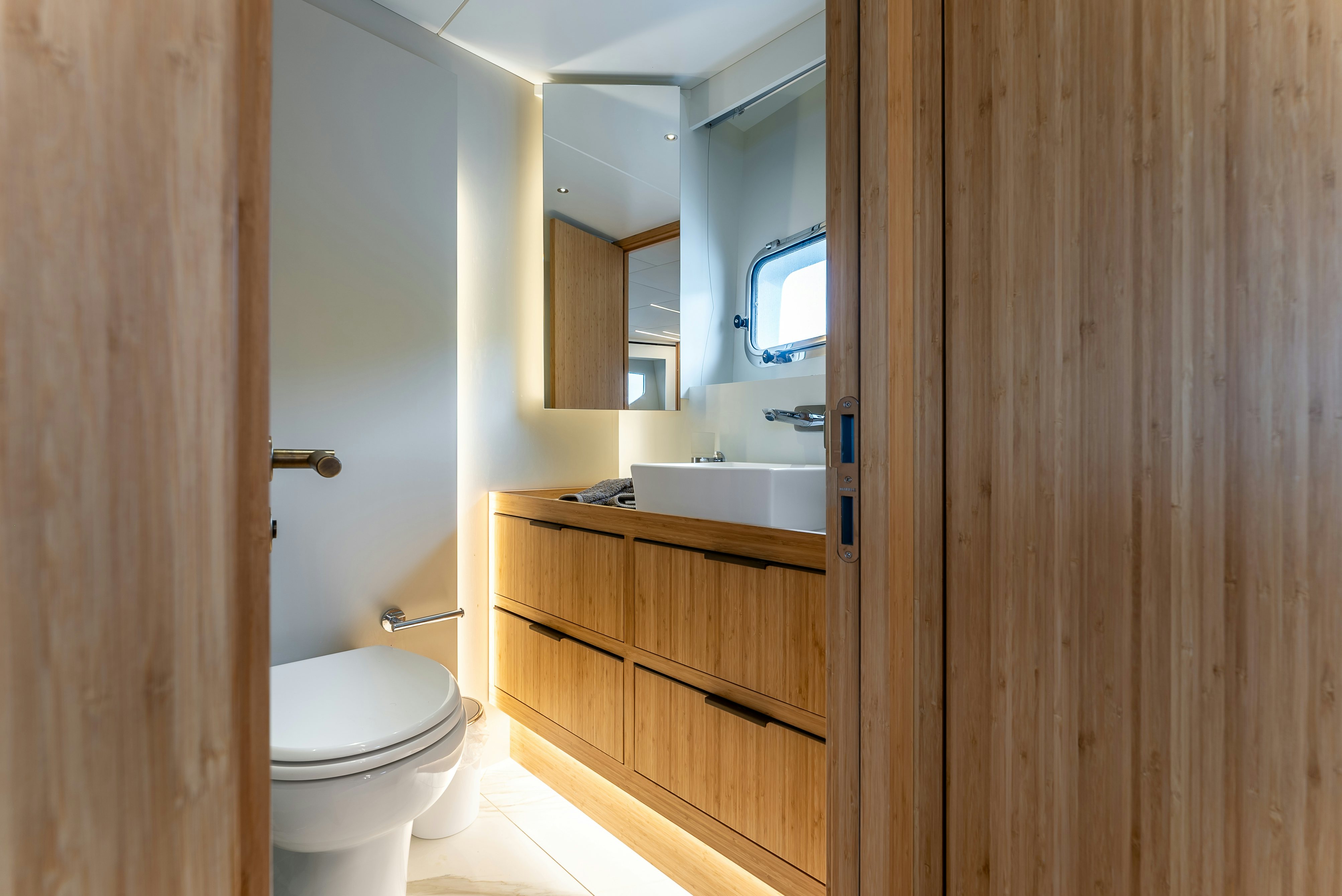 a bathroom with a toilet and sink aboard LITTLE MERMAID Yacht for Sale