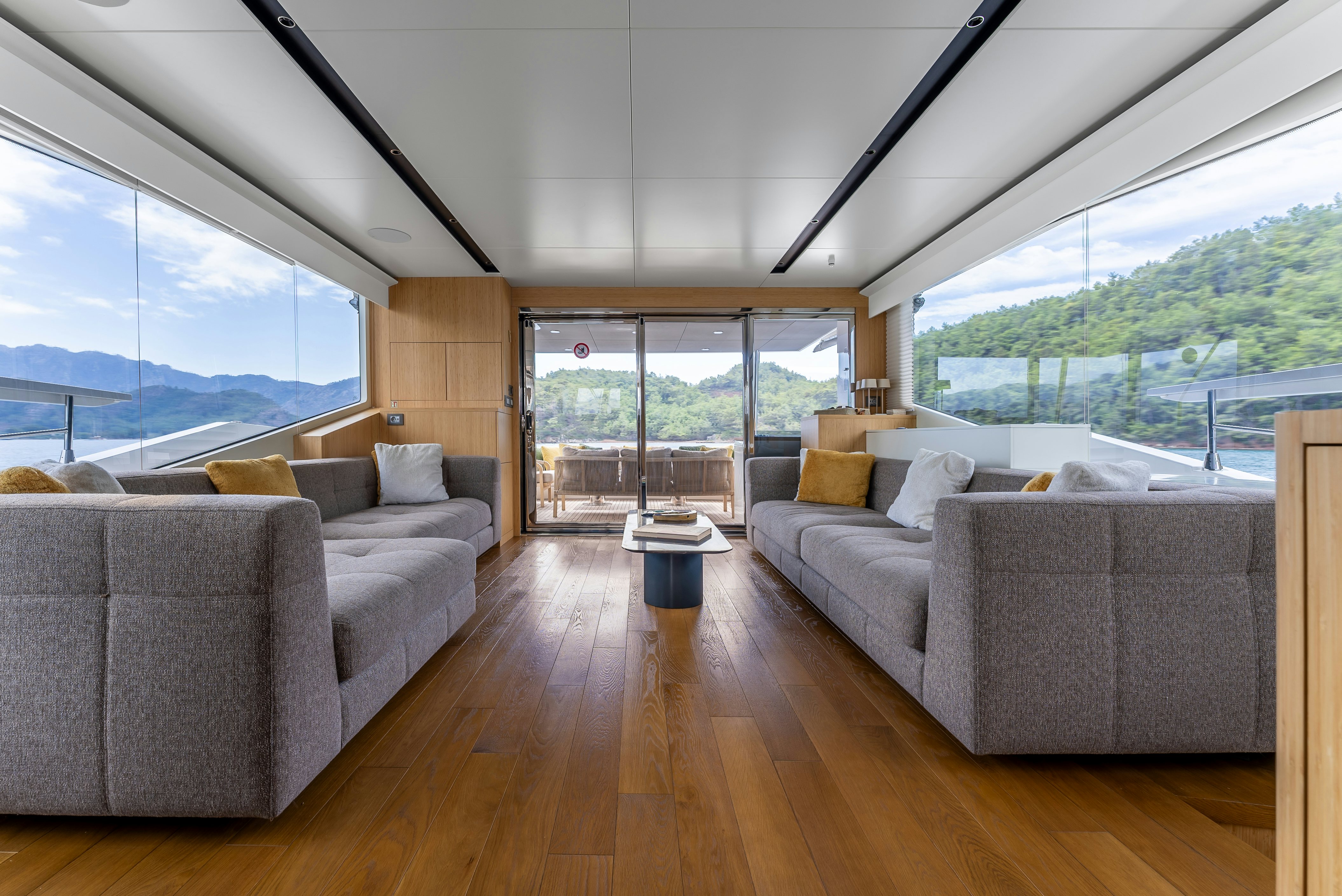 a living room with a large window aboard LITTLE MERMAID Yacht for Sale