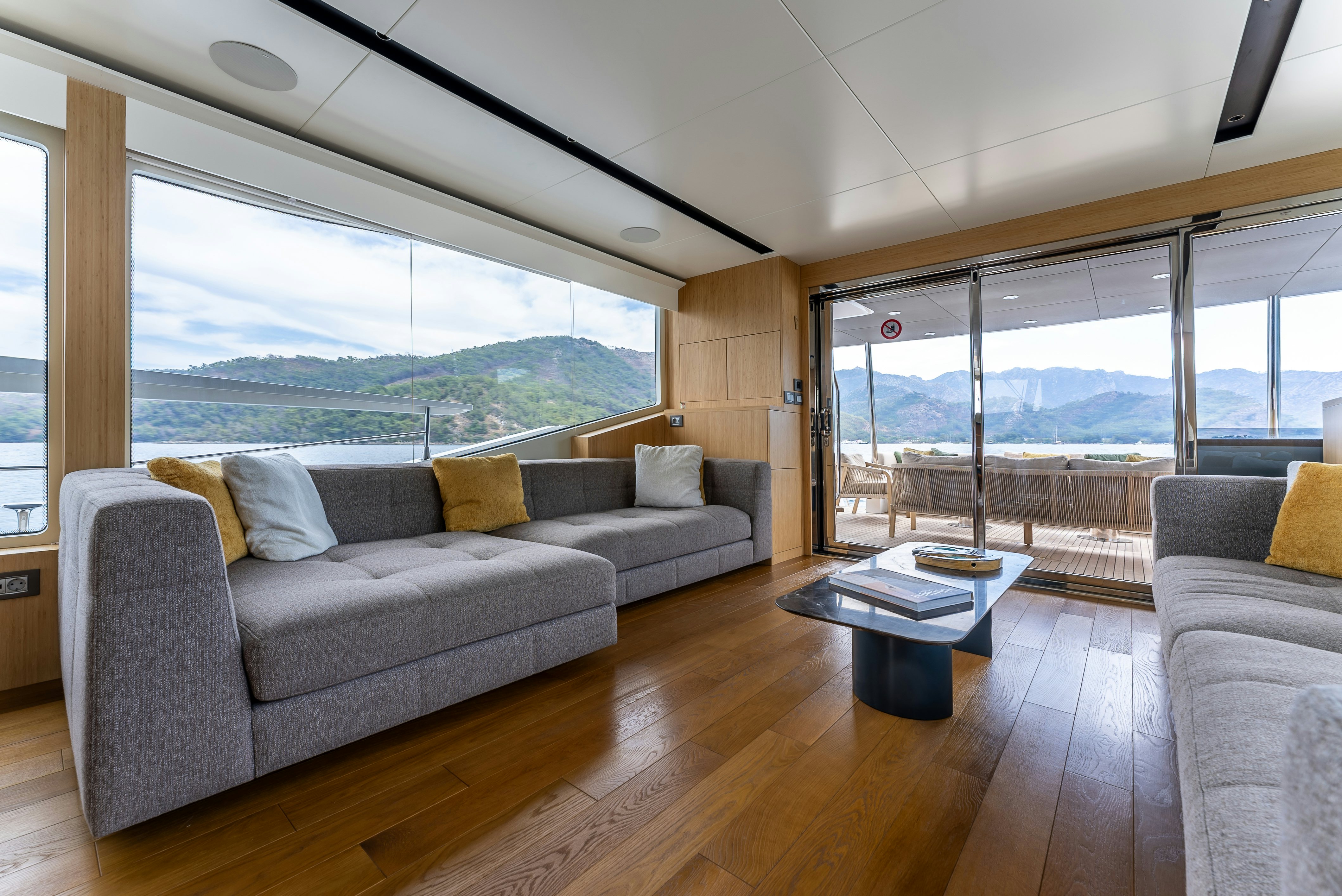 a living room with a large window aboard LITTLE MERMAID Yacht for Sale