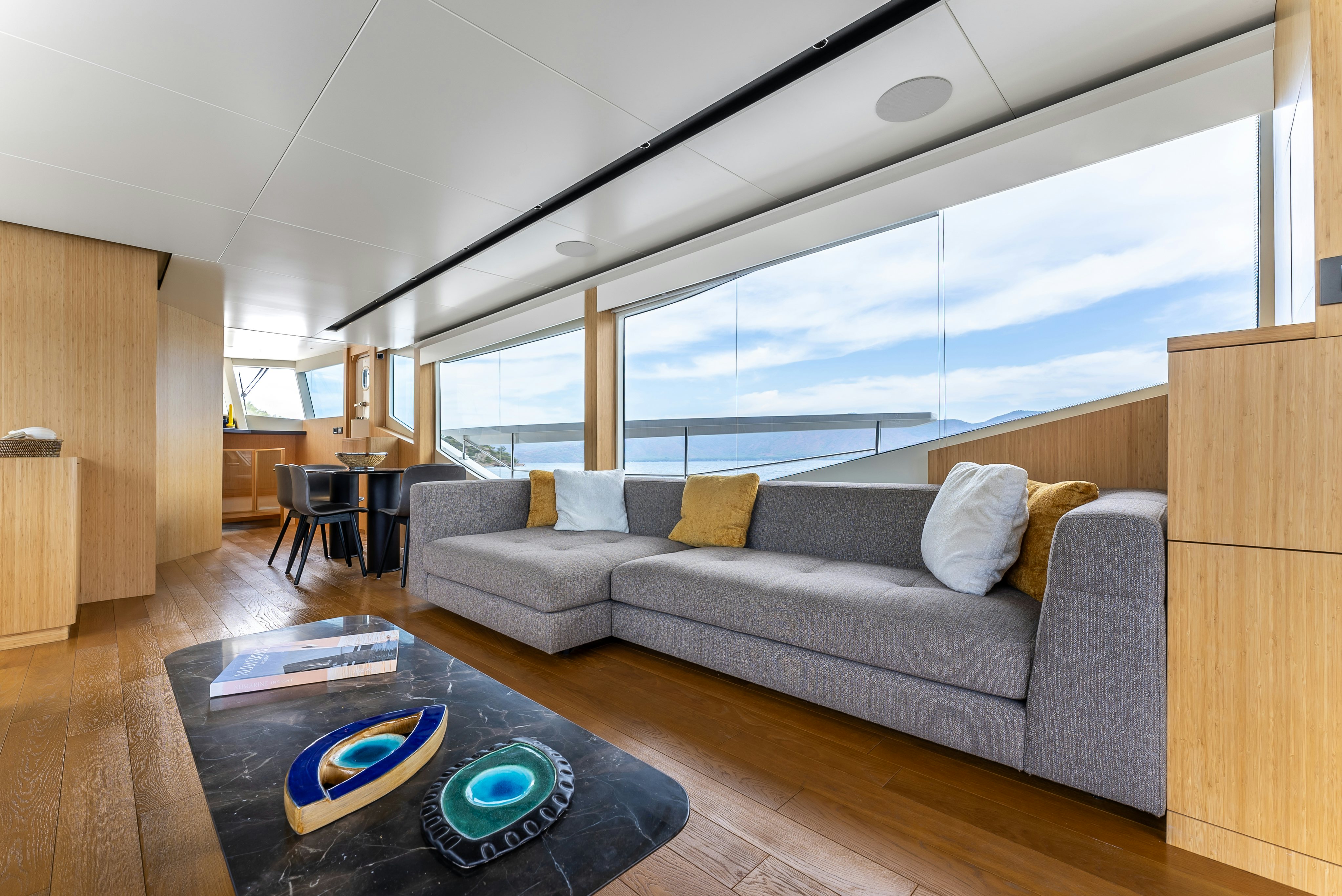 a living room with a large window aboard LITTLE MERMAID Yacht for Sale