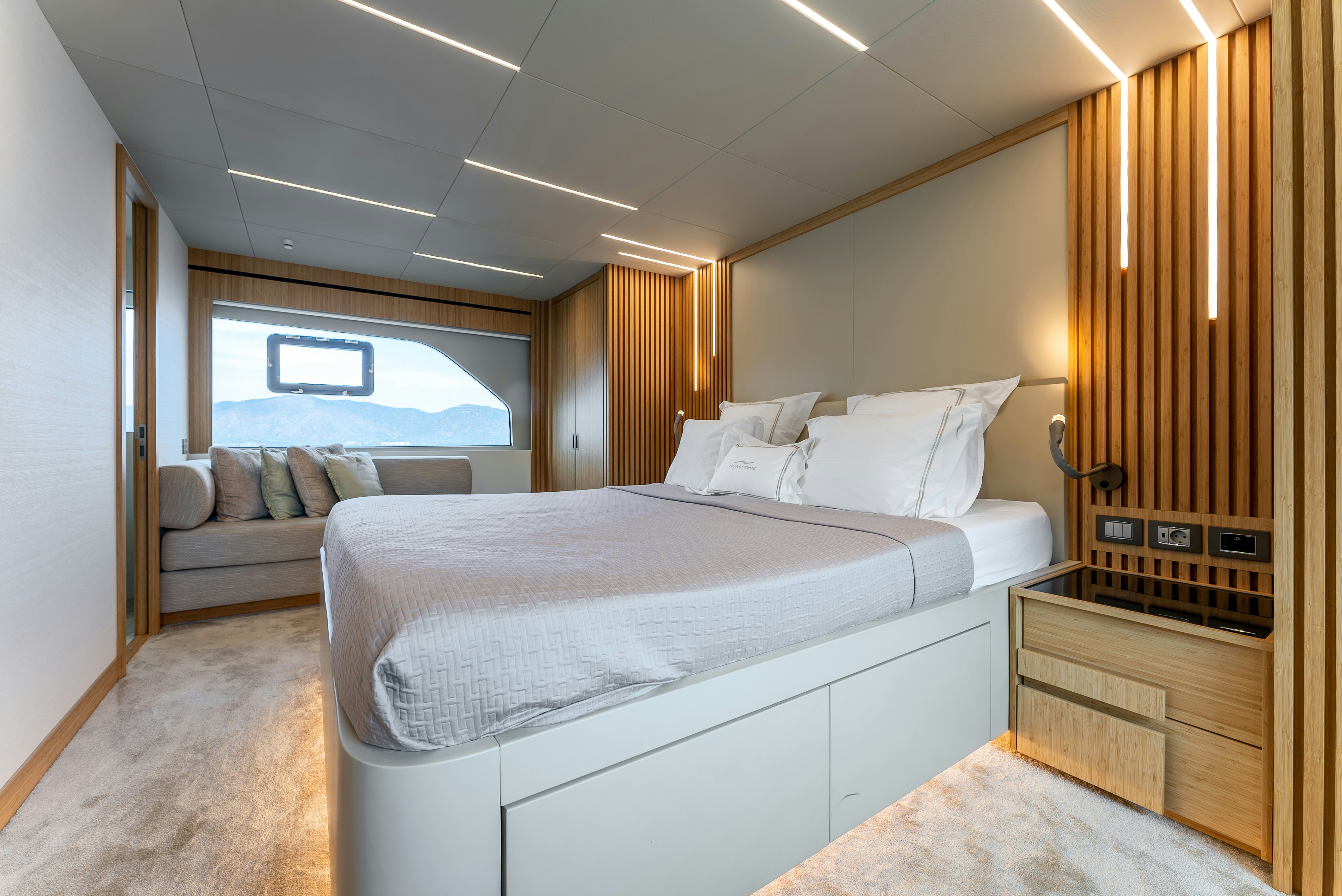 a room with a bed and a window aboard LITTLE MERMAID Yacht for Sale