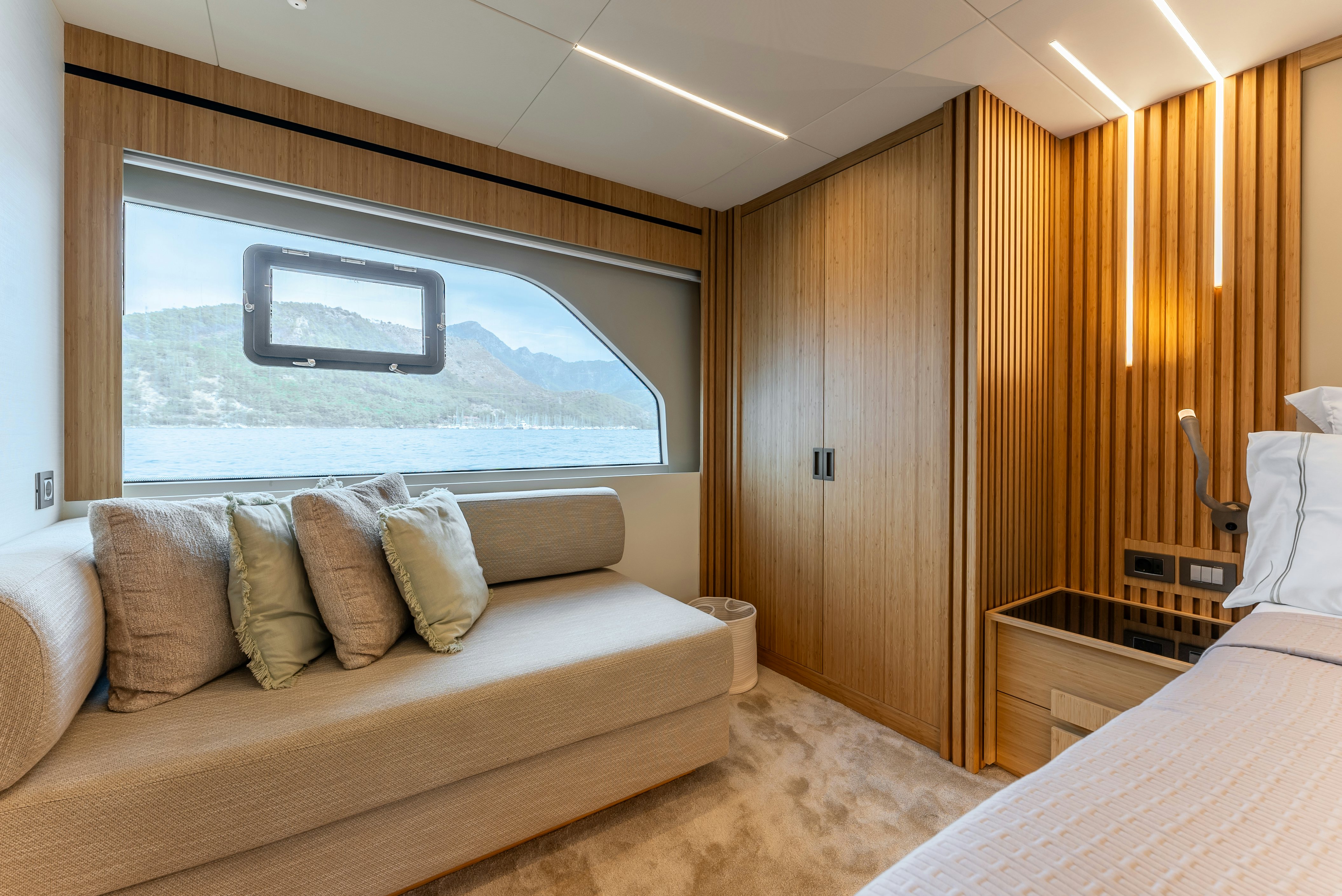 a room with a couch and a television aboard LITTLE MERMAID Yacht for Sale