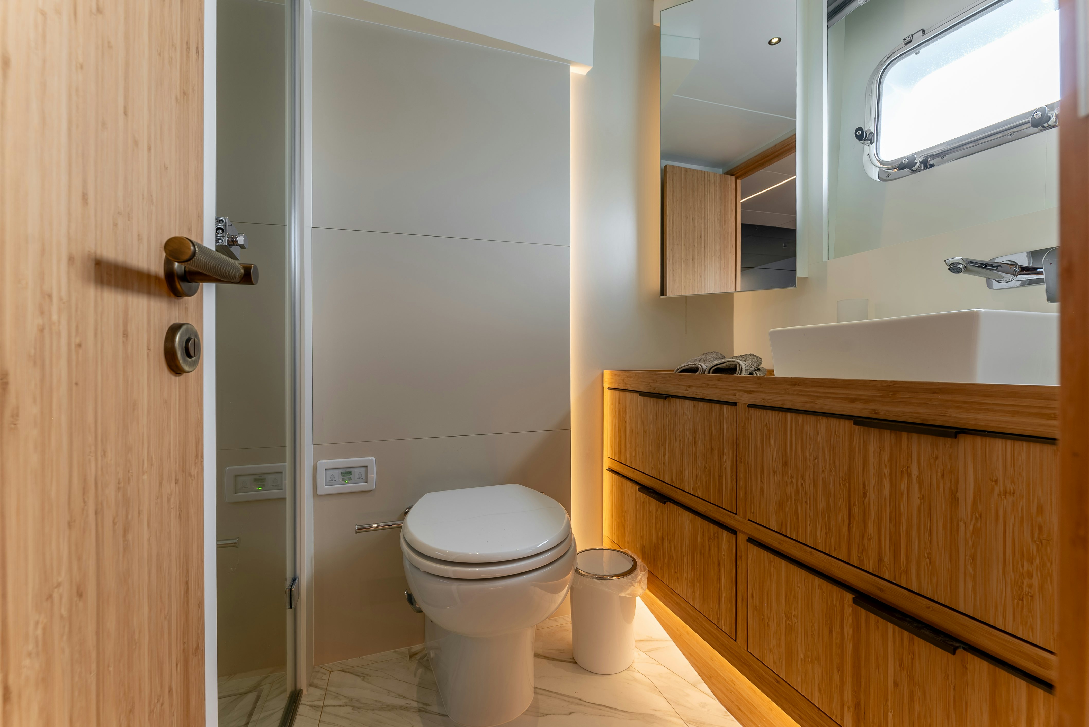 a bathroom with a toilet and a sink aboard LITTLE MERMAID Yacht for Sale