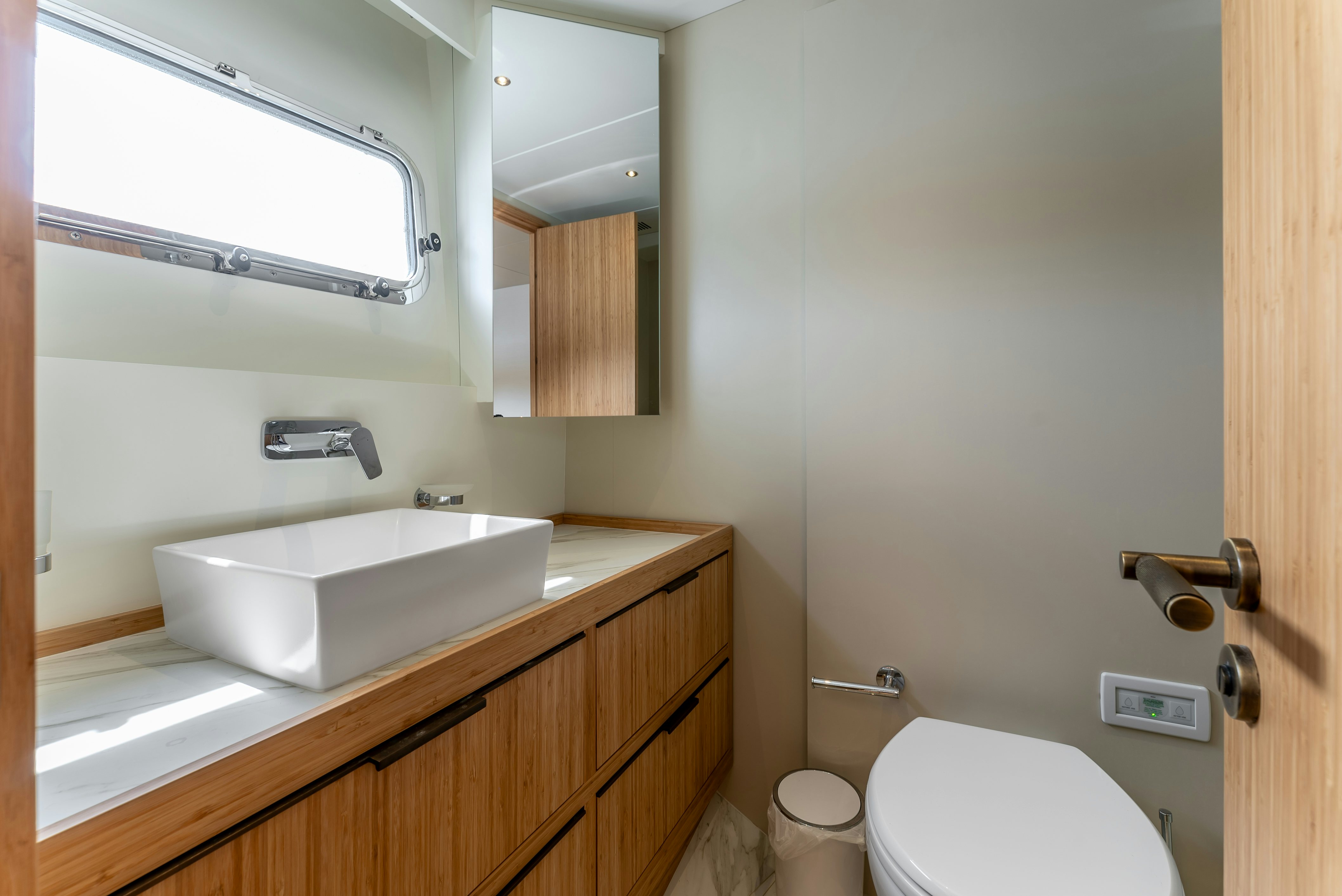 a bathroom with a sink and a toilet aboard LITTLE MERMAID Yacht for Sale