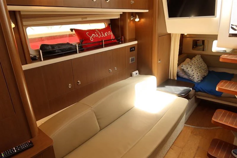 a room with a bed and a desk aboard BON VOYAGE Yacht for Sale