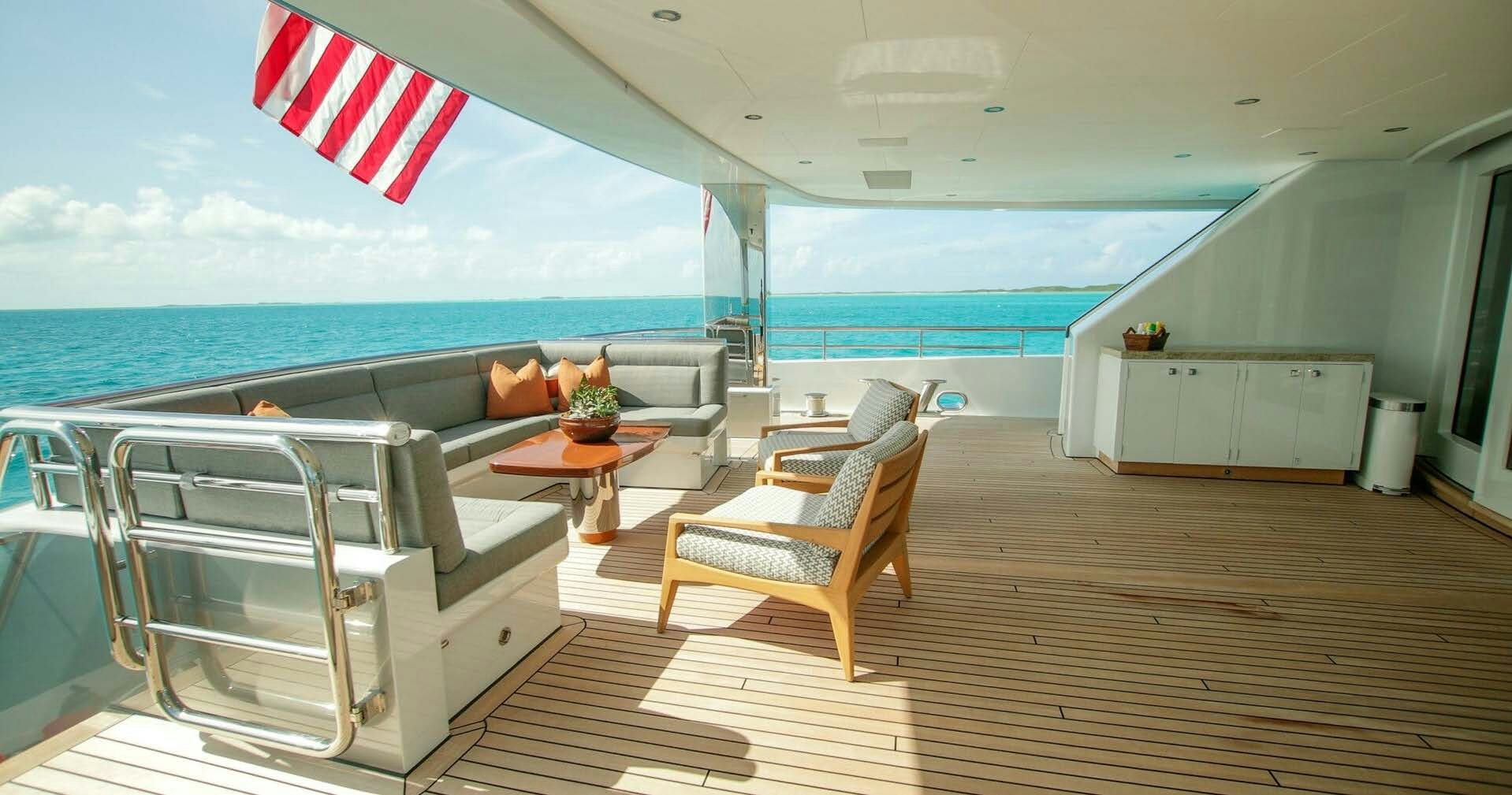 a deck with a view of the ocean and the deck aboard W Yacht for Charter
