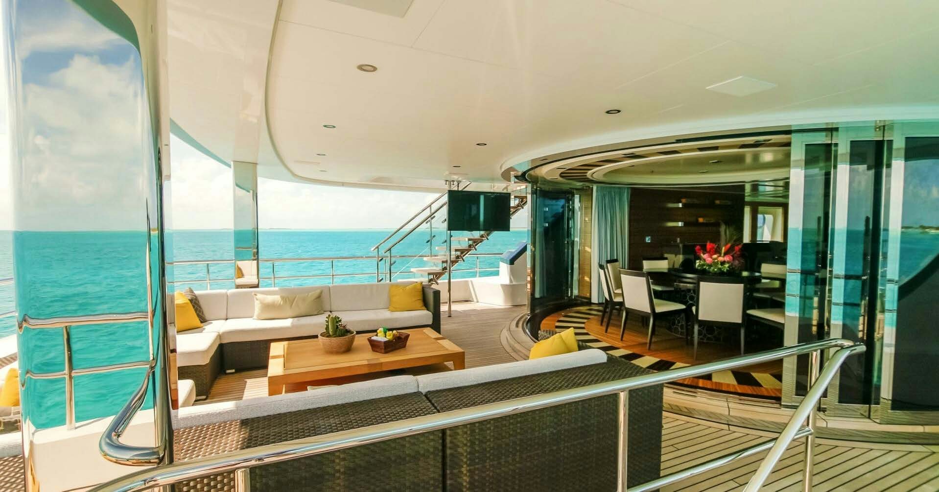 a room with a view of the ocean and the deck aboard W Yacht for Charter