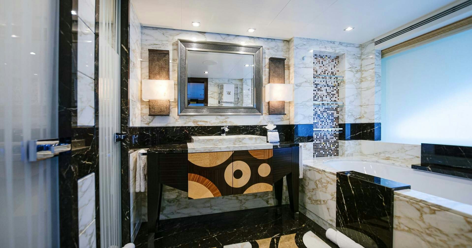 a bathroom with a fireplace aboard W Yacht for Charter