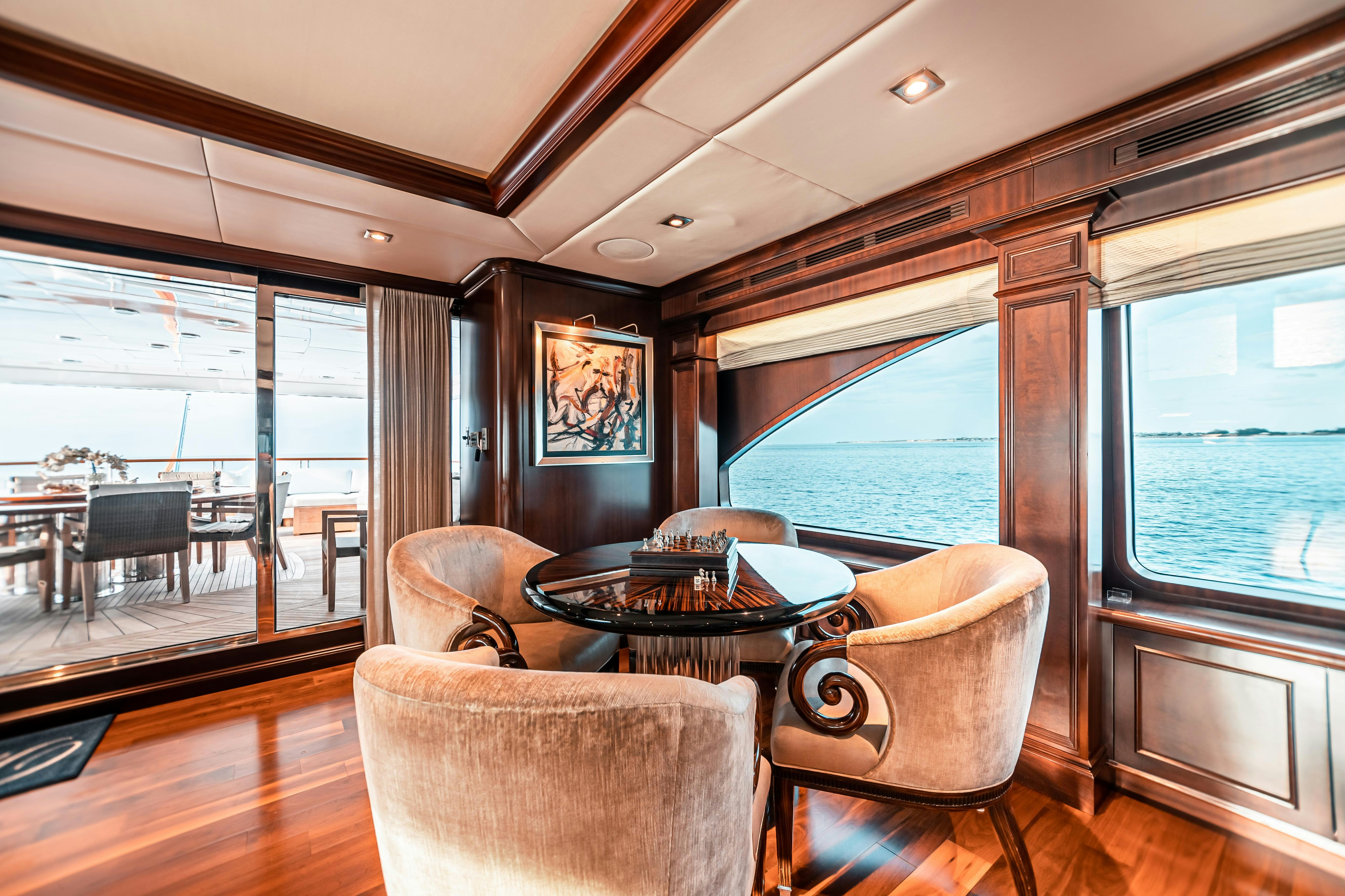 a dining room with a table and chairs aboard MIRABELLA Yacht for Charter