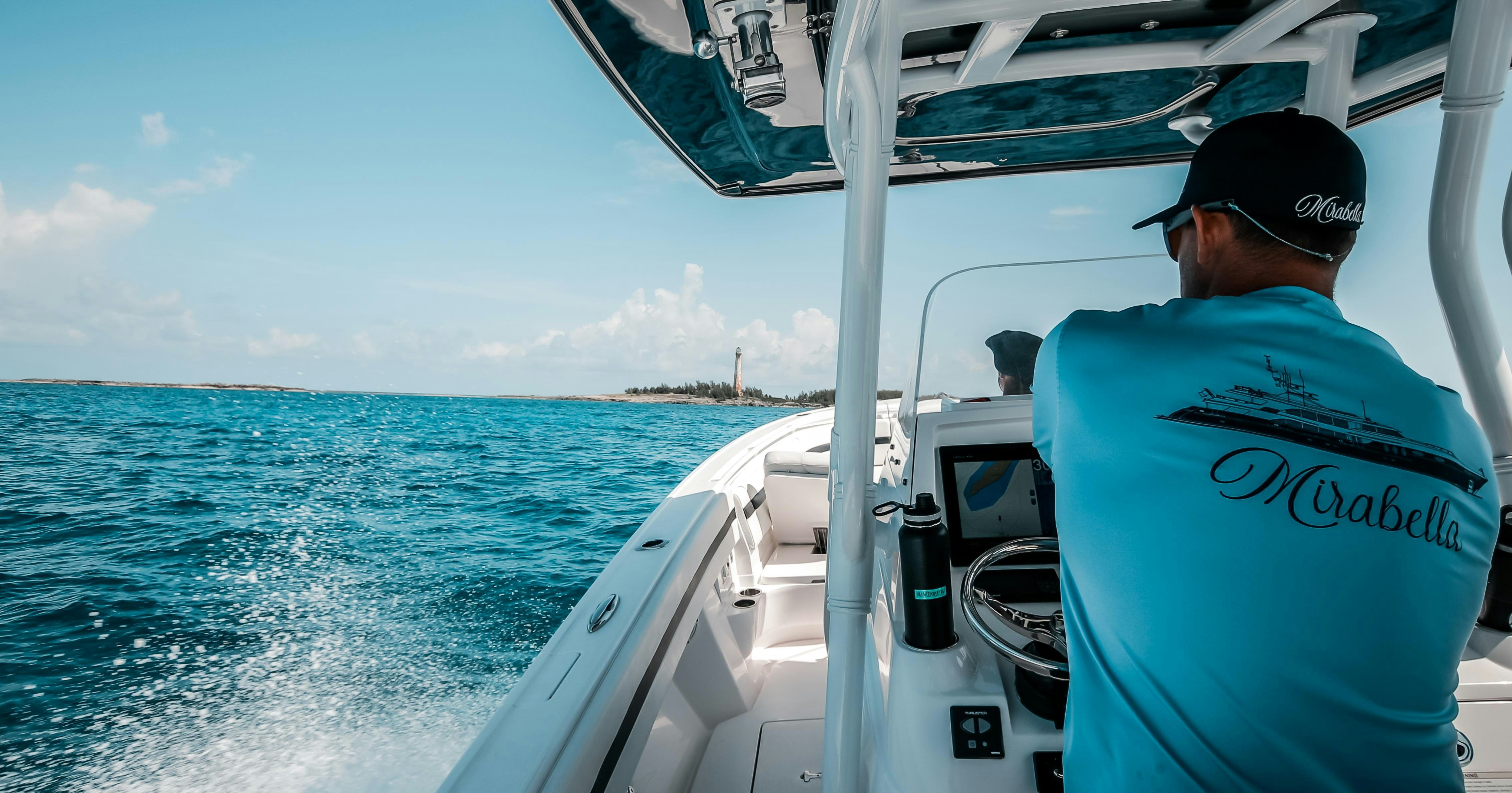 a man driving a boat aboard MIRABELLA Yacht for Charter