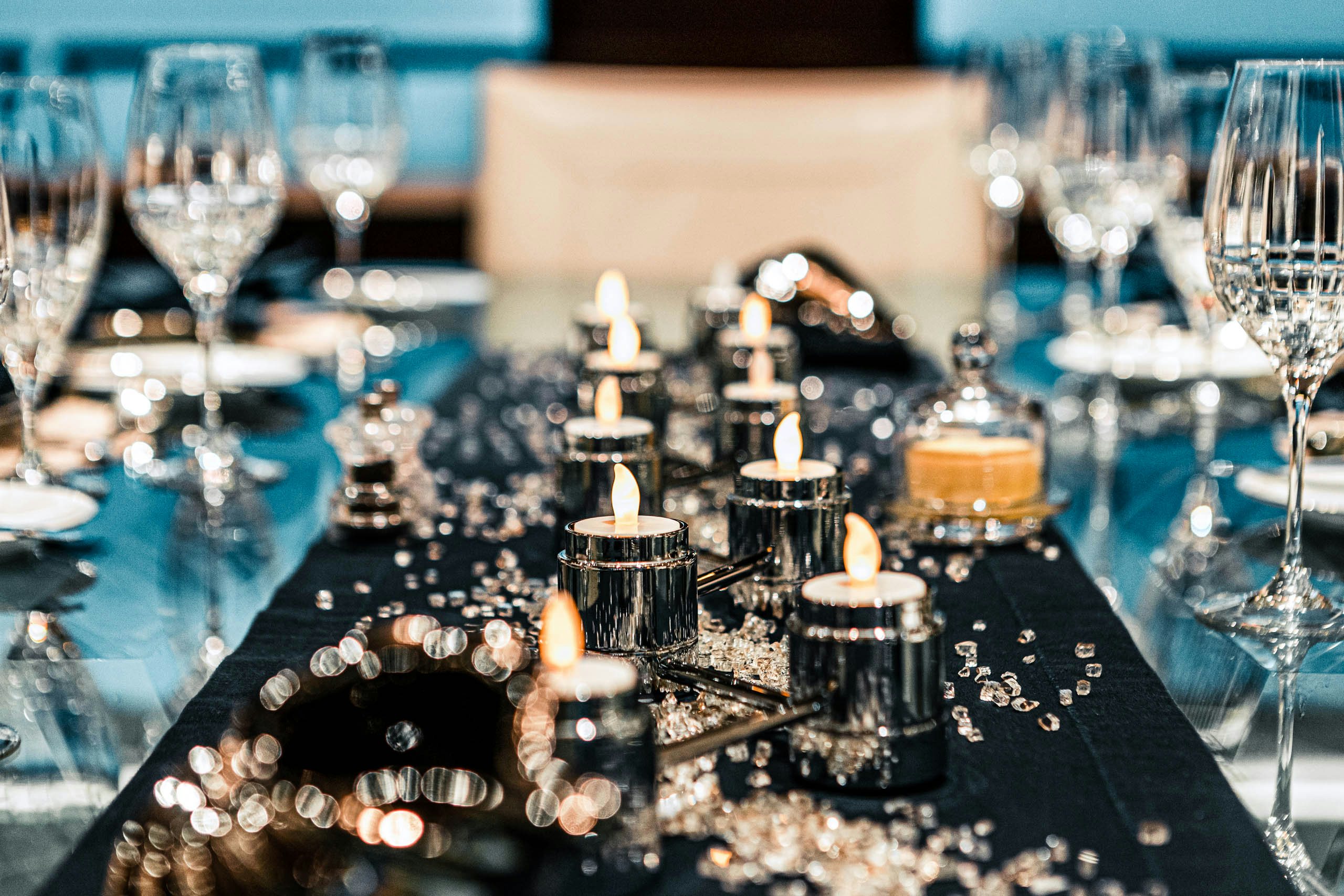 a table with many candles aboard MIRABELLA Yacht for Charter