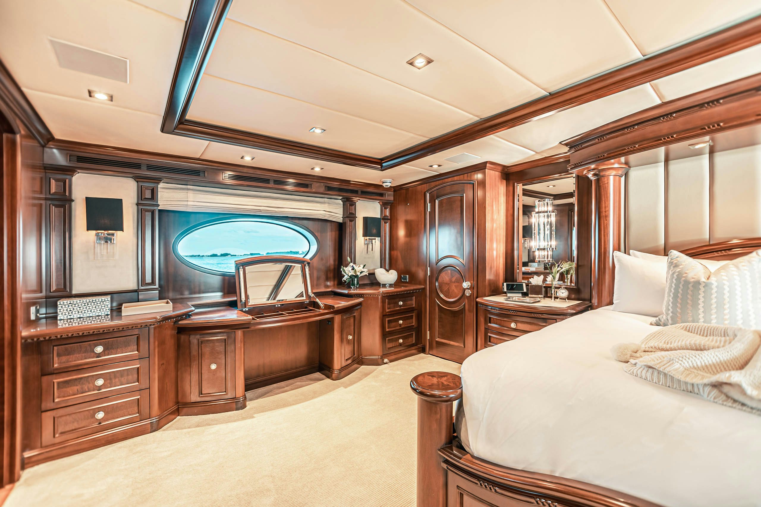 a bedroom with a large mirror aboard MIRABELLA Yacht for Charter