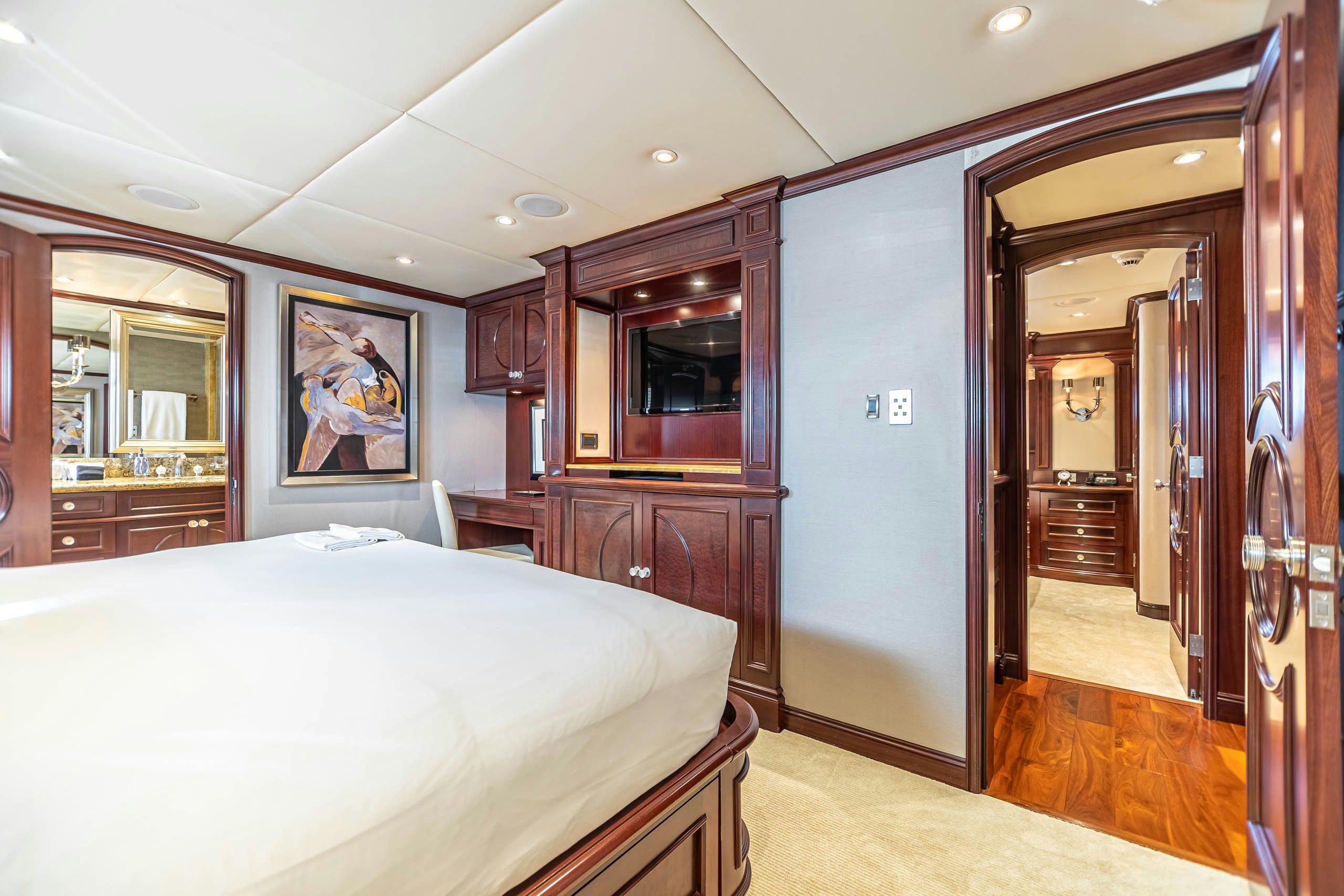 a bedroom with a large bed aboard MIRABELLA Yacht for Charter