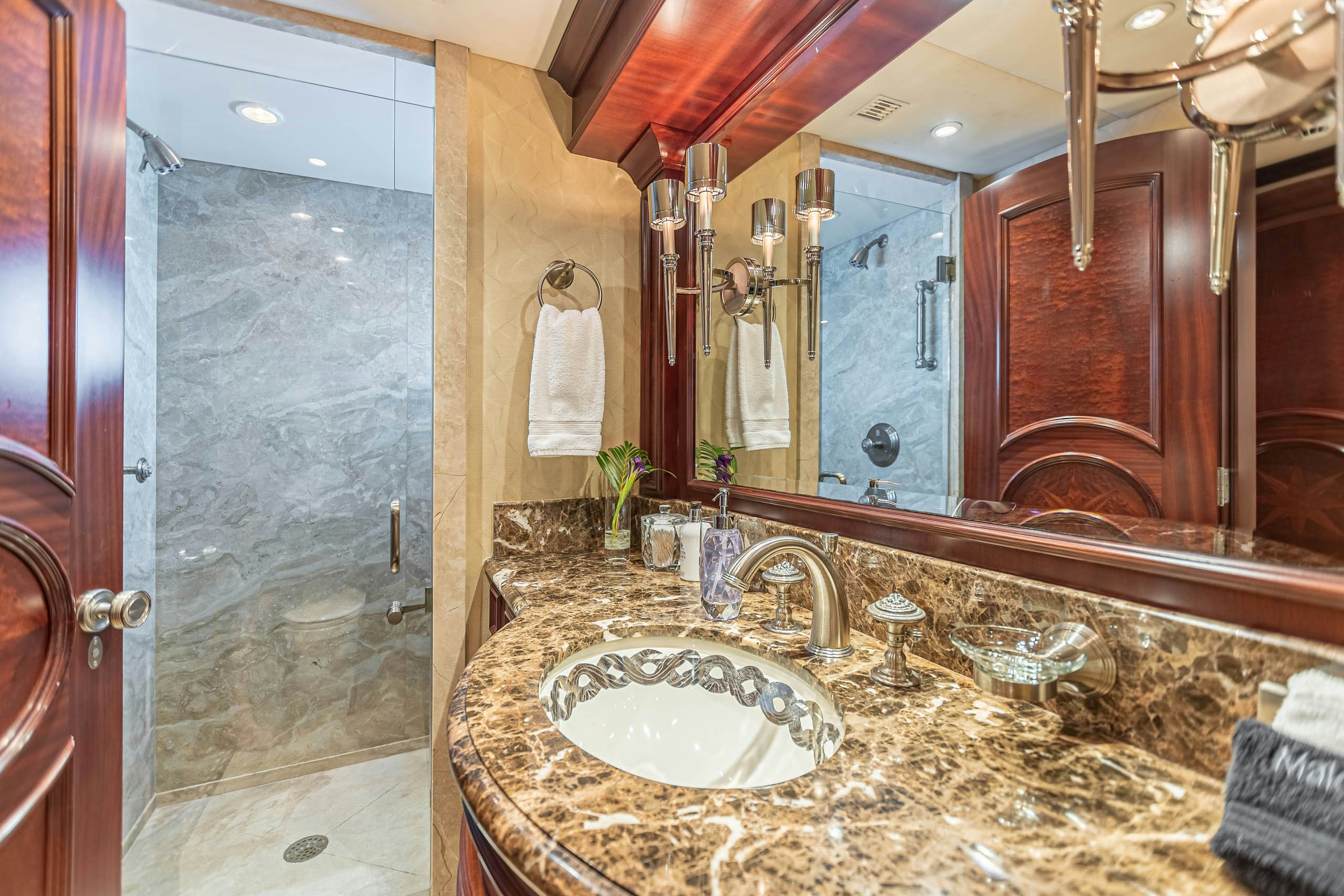 a bathroom with a large mirror aboard MIRABELLA Yacht for Charter