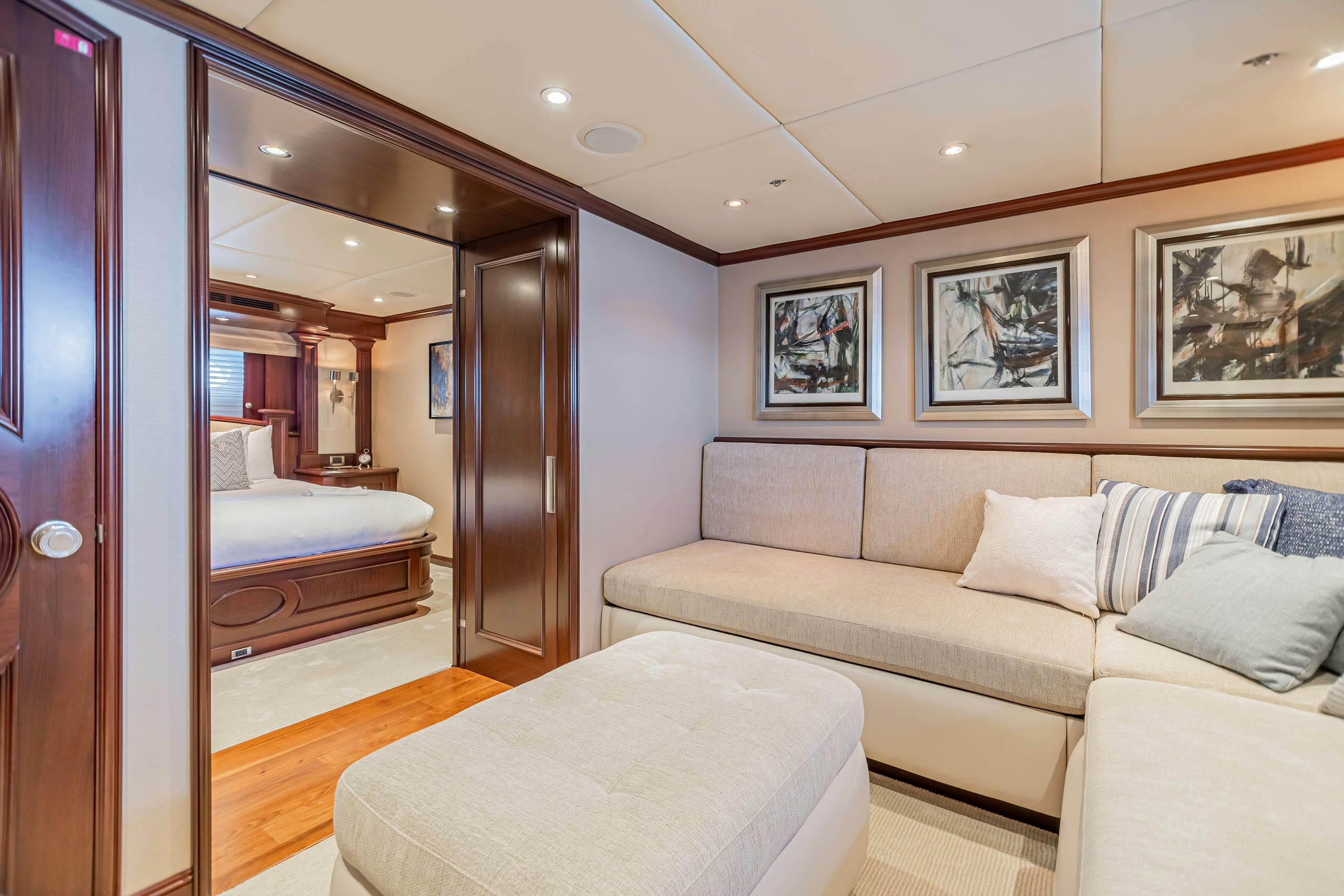 a bedroom with a bed and a mirror aboard MIRABELLA Yacht for Charter