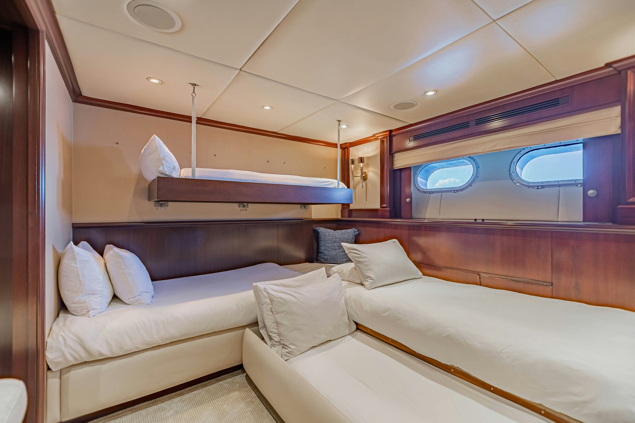 a room with a bed and a window aboard MIRABELLA Yacht for Charter