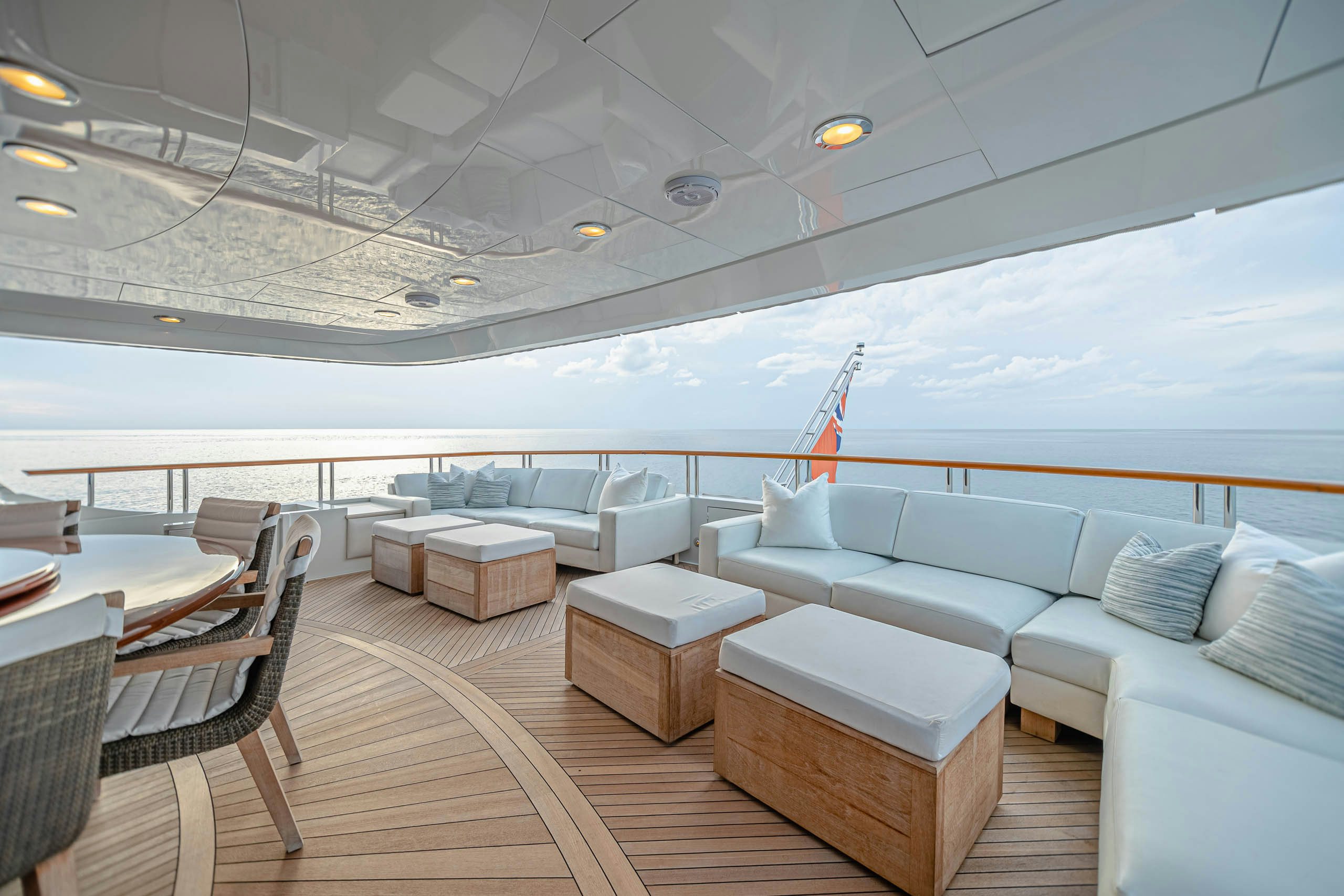 a large room with a couch and a table aboard MIRABELLA Yacht for Charter