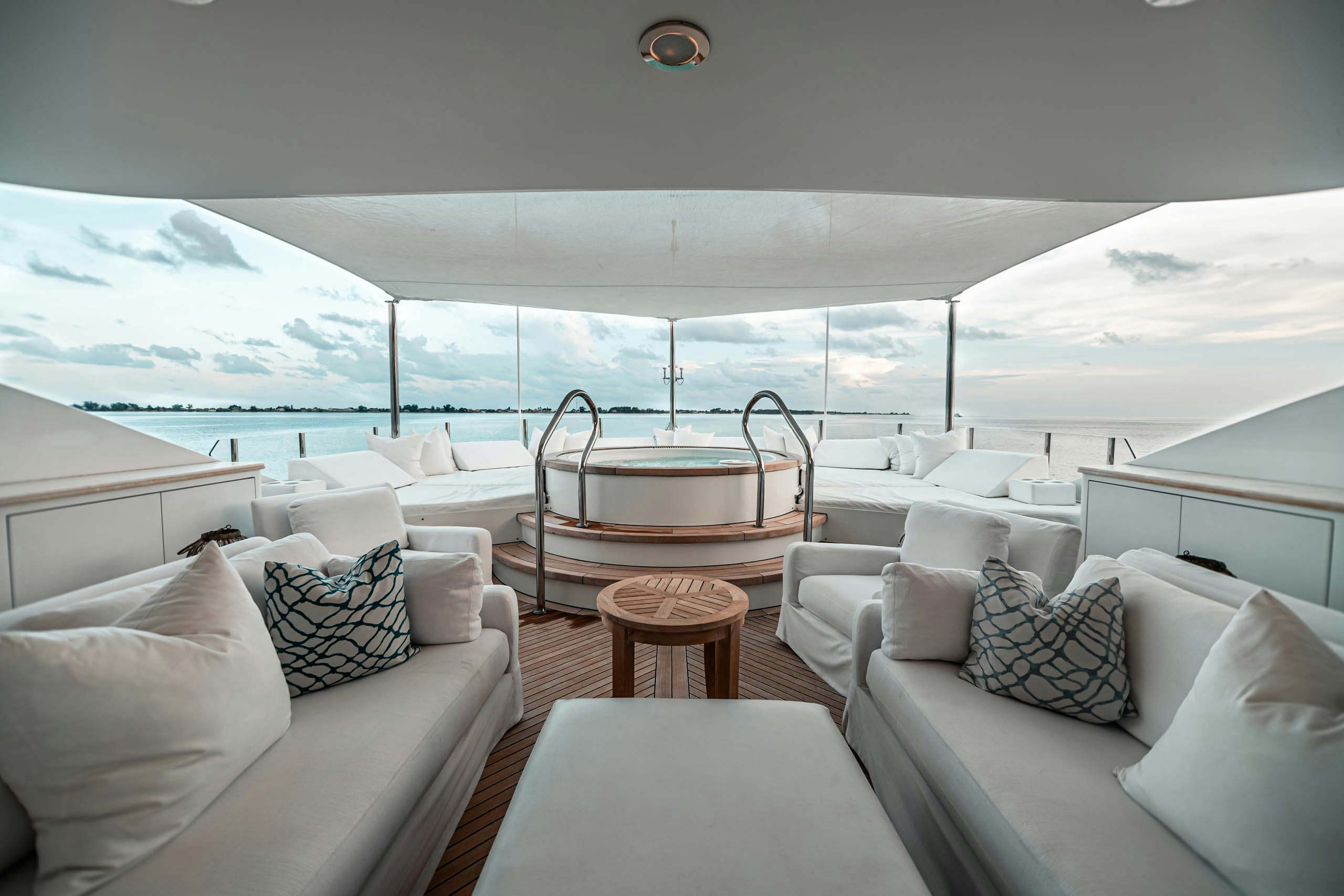 a white car with a table and chairs on a boat aboard MIRABELLA Yacht for Charter