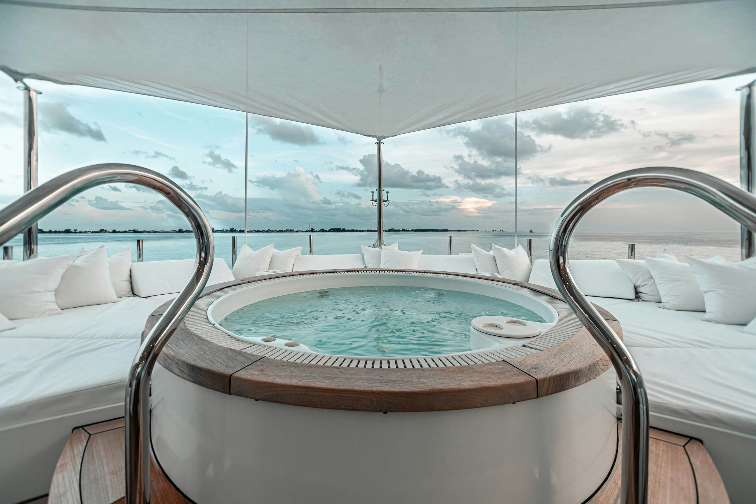 a room with a view of the mountains and the ocean aboard MIRABELLA Yacht for Charter